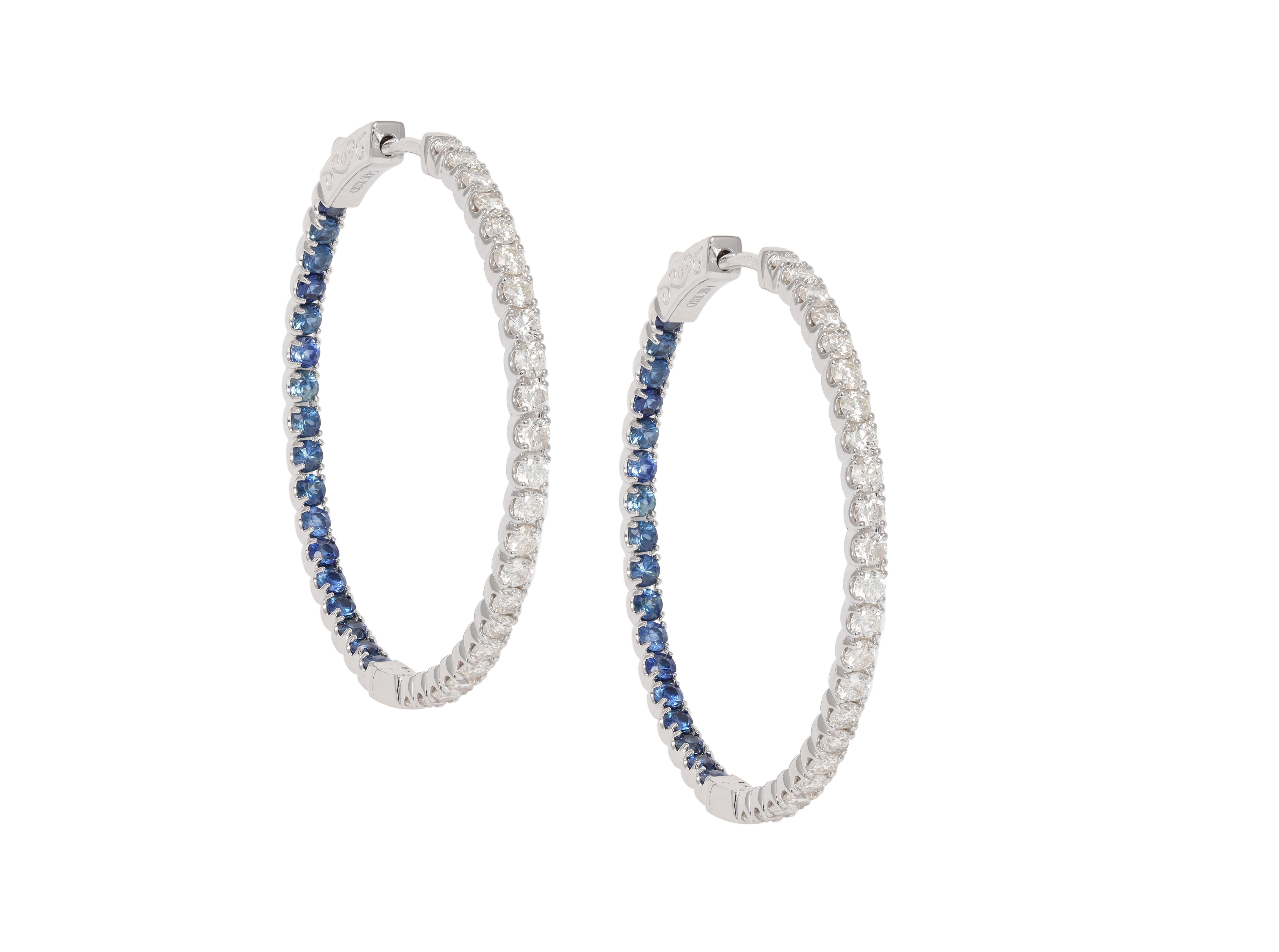 14K White Gold Sapphire And Diamond Hoop Earrings featuring 1.40 Carats T.W. of Sapphires and 1.50 Carat T.W. Diamonds

Underline your look with this sharp 14K White Gold Diamond and Sapphire Earrings. High quality Diamonds and sapphires. This