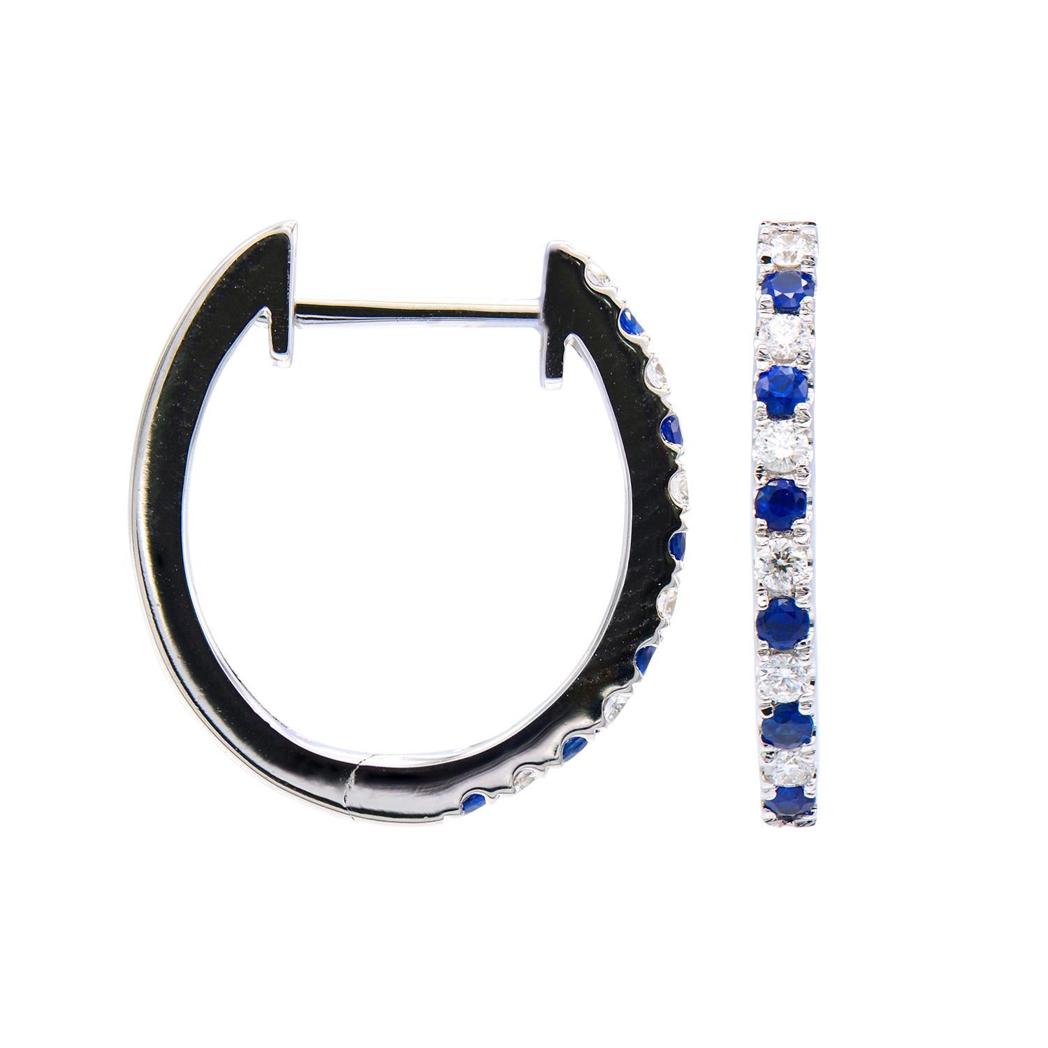 These hoops are elegant and beautiful. They are made from 2.4 grams of 14 karat white gold with a row of 24 round alternating diamonds on the front side. 12 diamonds are SI, H color and total 0.13 carats; the 12 sapphires total 0.16 carats. The