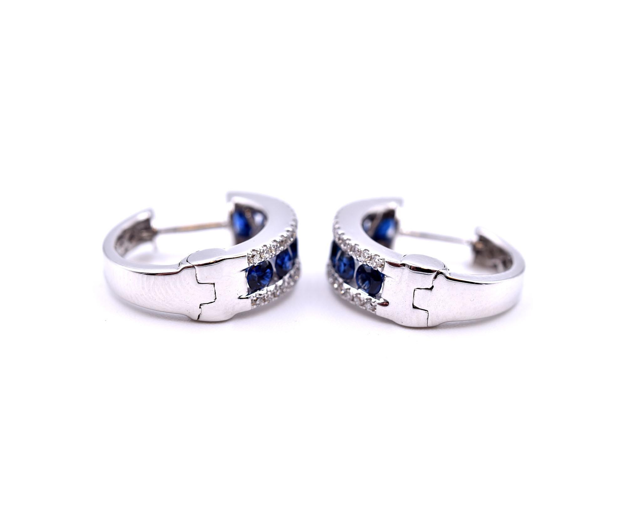 Designer: custom design
Material: 14k white gold
Gemstones: 12 round sapphires = 0.85cttw
Diamonds: 68 round brilliant cuts = 0.34cttw
Color: G
Clarity: VS
Dimensions: earrings measure approximately 15.70mm by 5.15mm
Fastenings: huggie style
Weight: