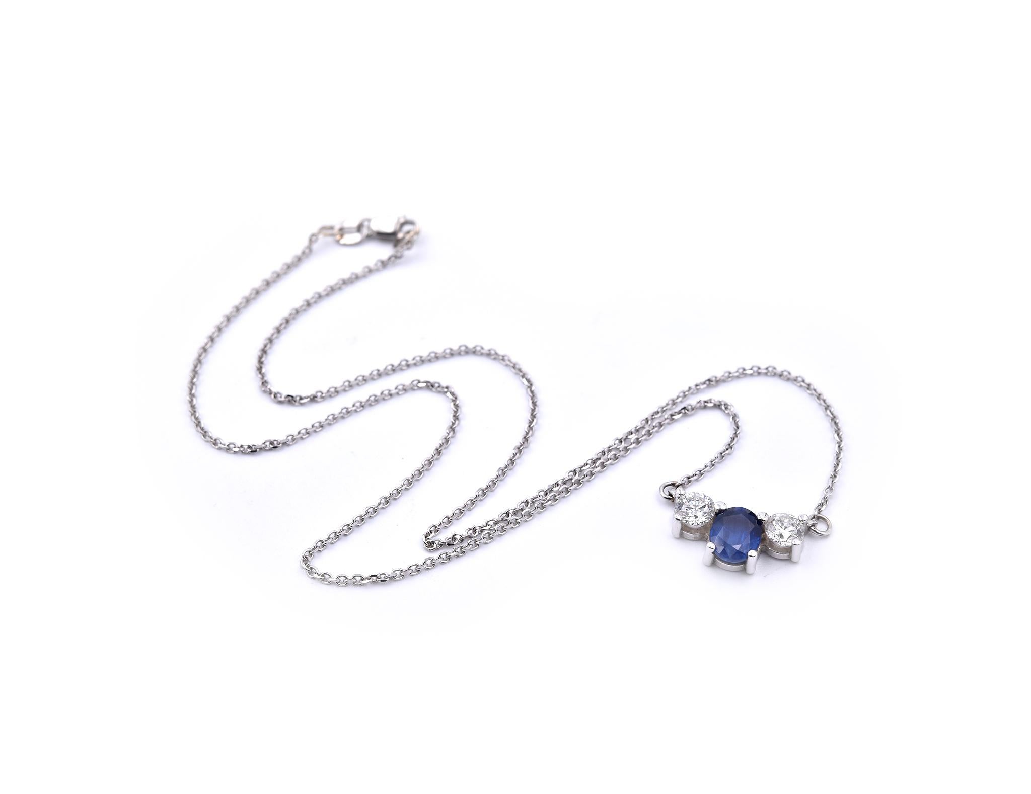 Designer: custom design
Material: 14k White Gold
Sapphire: 1 oval cut sapphire 
Diamonds: 2 round brilliant cuts = 0.80
Color: G
Clarity: VS2-SI1
Dimensions: ﻿necklace measures 15-inches in length
Weight: 3.60 grams