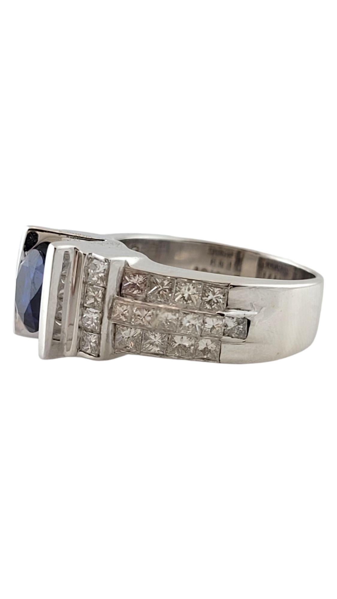 Vintage 14K White Gold Sapphire and Diamond Ring Size 7.25-7.5

This stunning ring is set with a floating center synthetic round modified brilliant sapphire.

Sapphire was graded by EGL to be 1.67 cts.

36 princess cut diamonds surround the