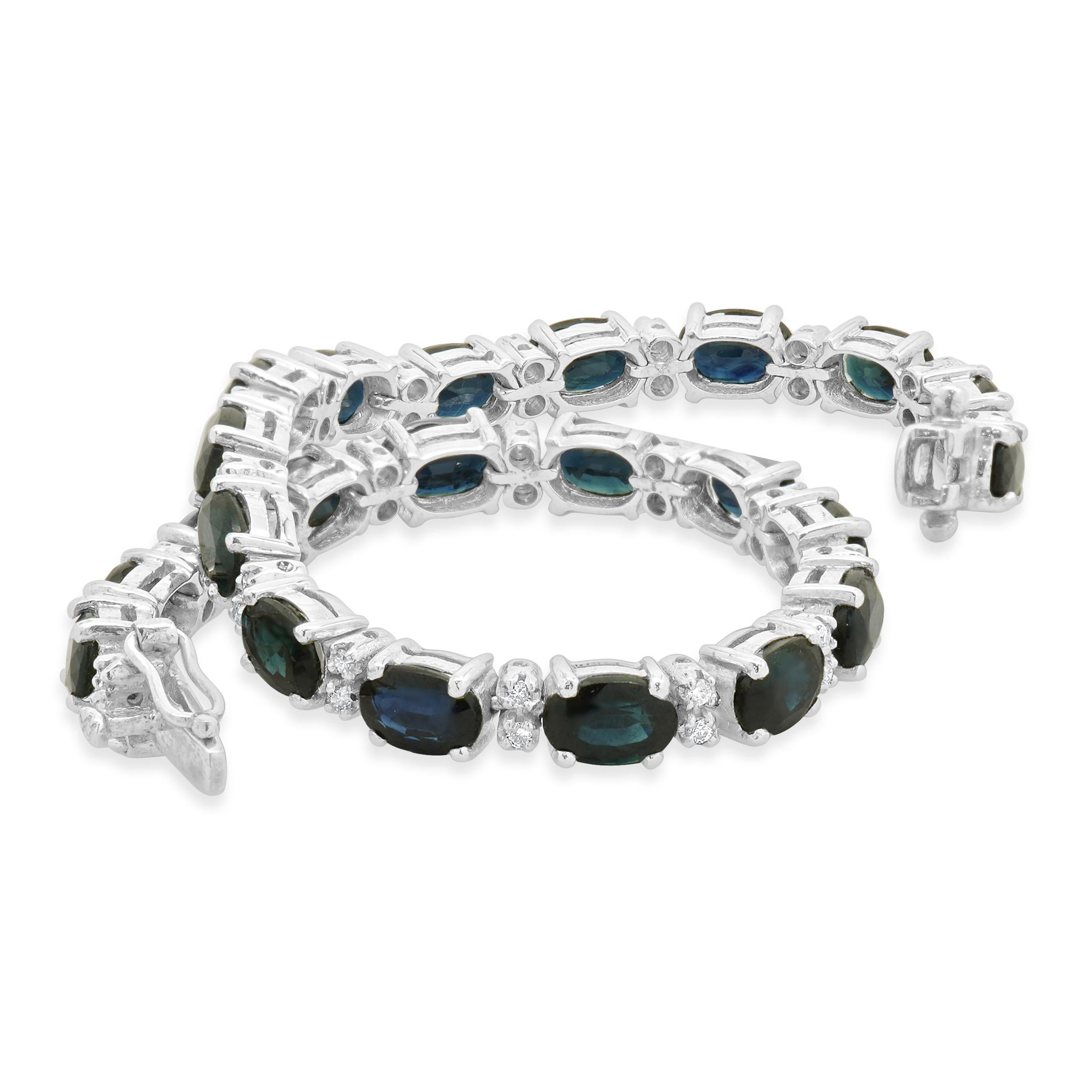 Designer: custom
Material: white gold
Diamonds: 44 round brilliant cut = 0.26cttw
Sapphires: 23 oval cut = 11.50cttw
Length: bracelet will fit up to a 7.0-inch wrist
Weight: 14.88 grams
