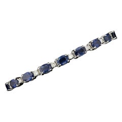 Tennisarmband aus 14 Karat Weißgold mit Saphiren und Diamanten