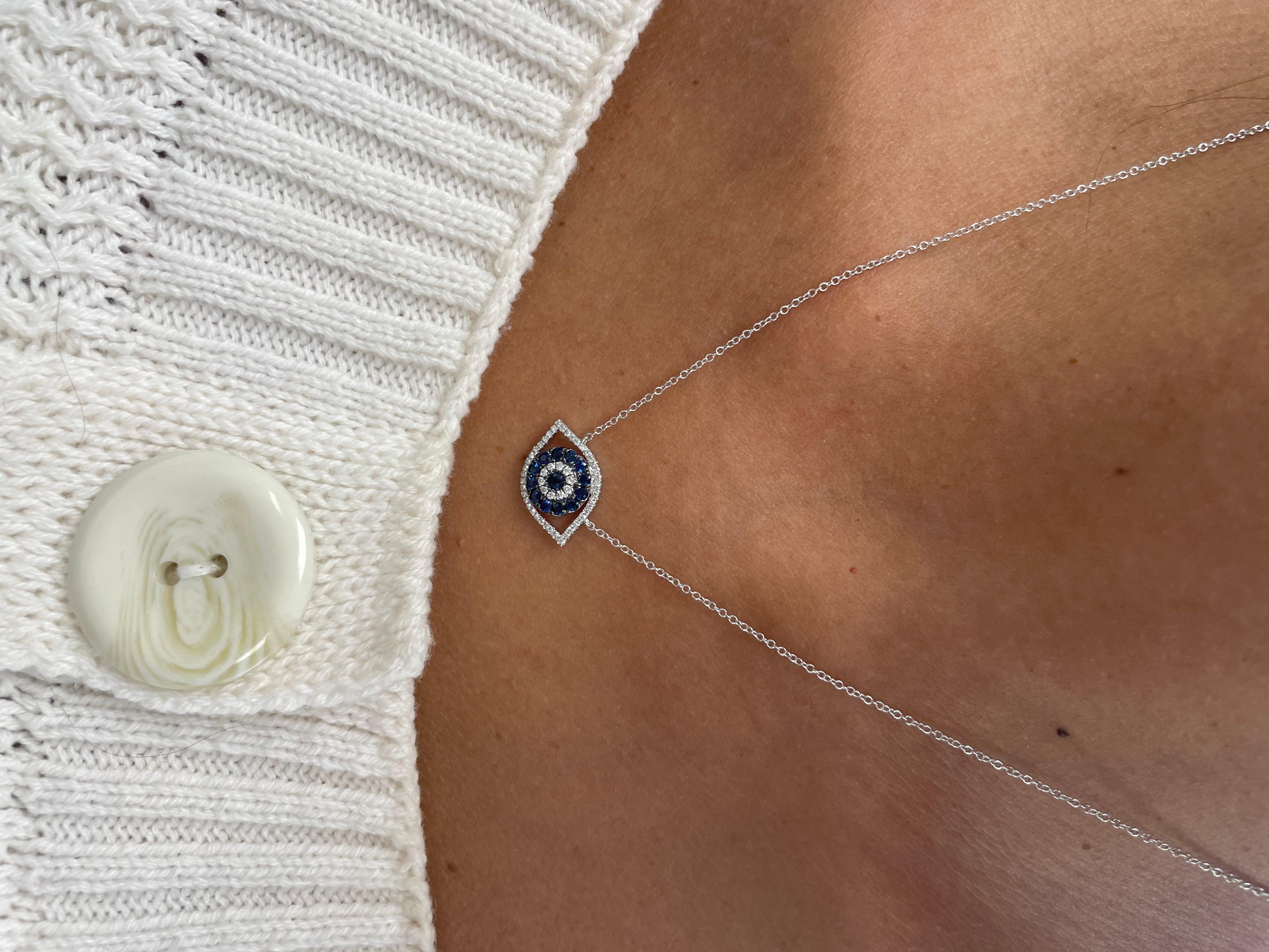 Feel Protected and Guarded with this Evil Eye Necklace! Crafted of 14K Gold this pendant features 0.16 carats of natural white Diamonds and 0.48 carats of Blue Sapphires. Comes on an 16