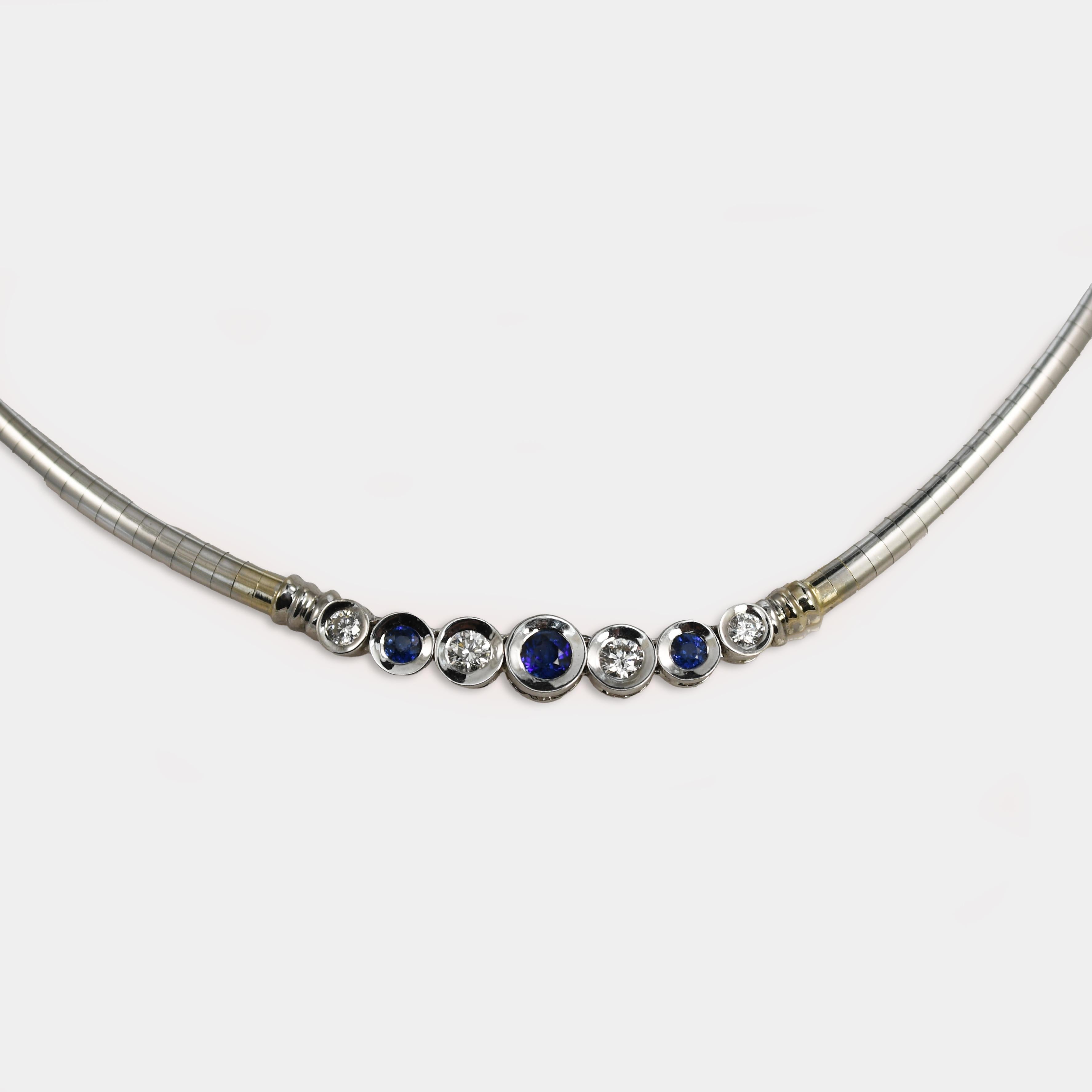 Ladies' sapphire and diamond necklace with 14k white gold setting.
Stamped 14k Italy and weighs 22.2 grams.
The blue sapphires are round brilliant cuts, .40 total carats, and attractive colors.
The diamonds are round brilliant cuts, .33 total