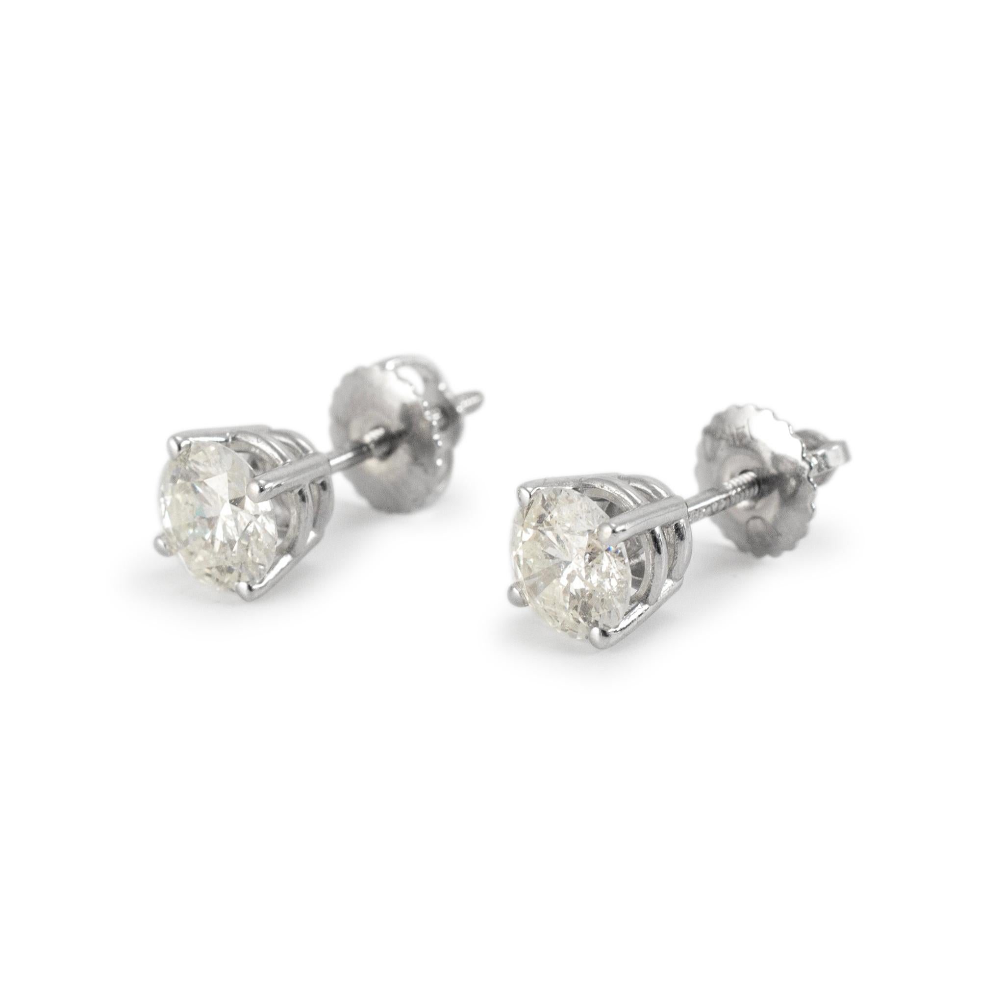 Gender: Ladies

Metal Type: 14K White Gold

Length: 0.50 inches 

Diameter: 5.20 mm

Weight: 1.11 Grams

One pair of custom made polished 14K white gold diamond stud earrings with screw backs. The metal was tested and determined to be 14K white