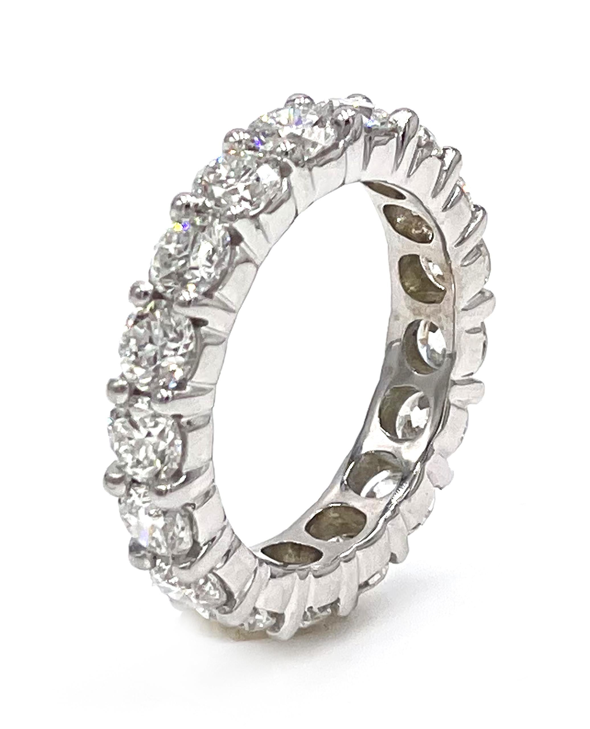 14K white gold shared prong eternity band furnished with 17 round brilliant-cut diamonds 4.06 carats total weight: G/H color, VS2/SI1 clarity.

* Finger size 6