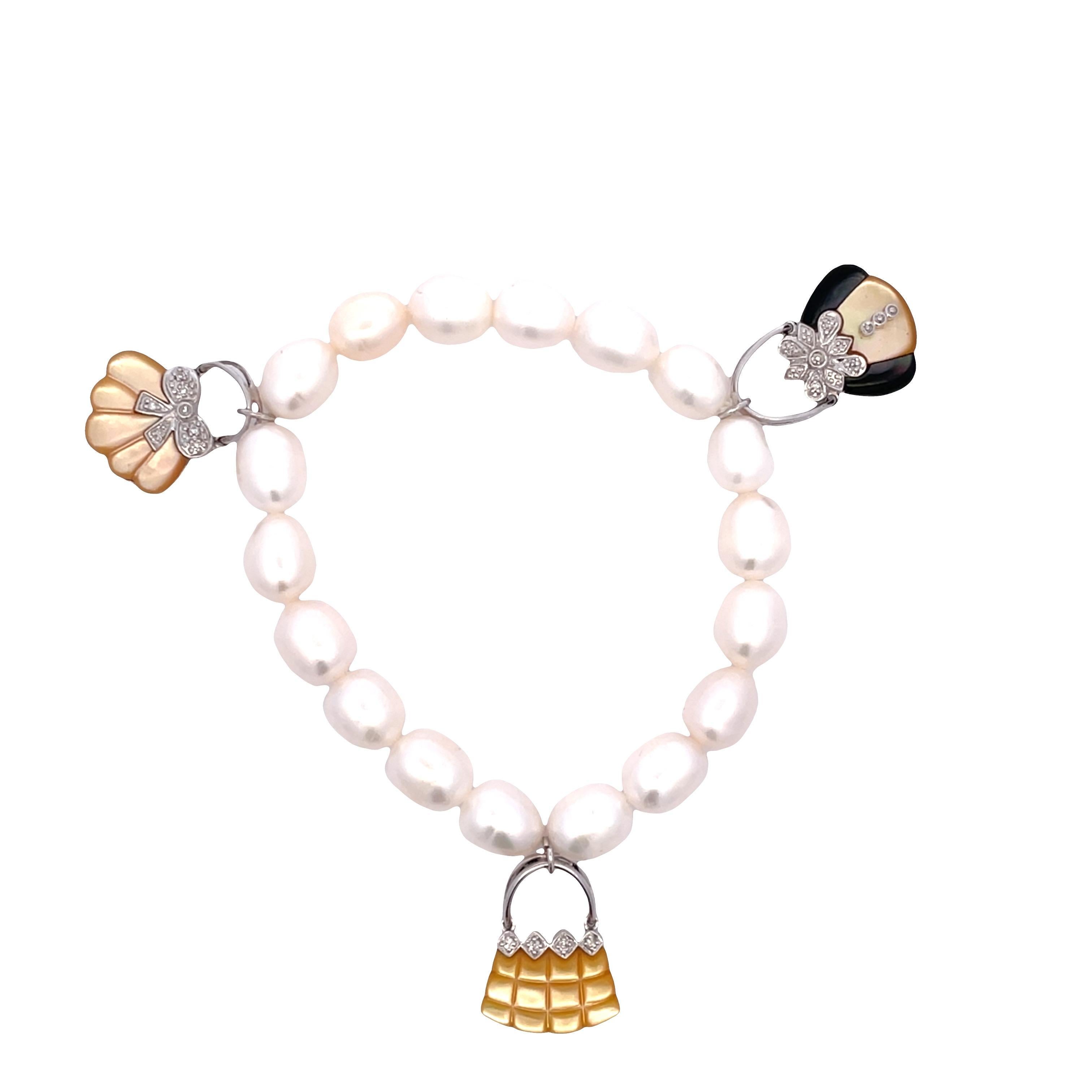 Elevate your accessory game with our exquisite Pearl Bracelet featuring a unique lock and three stunning purse charms. This beaded bracelet is crafted with a luxurious blend of gemstones, including Shell, Mother of Pearl, Onyx, and a touch of