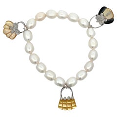 14k White Gold Shell, Mother of Pearl & Onyx Bag Charm Pearl Bracelet