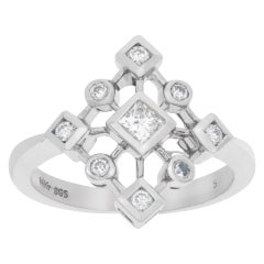 Vintage 14k white gold snowflake ring with 0.25 carat in princess cut and round diamonds