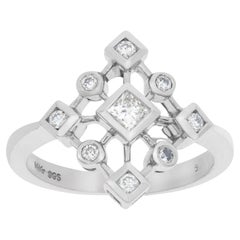 Vintage 14k white gold snowflake ring with 0.25 carat in princess cut and round diamonds