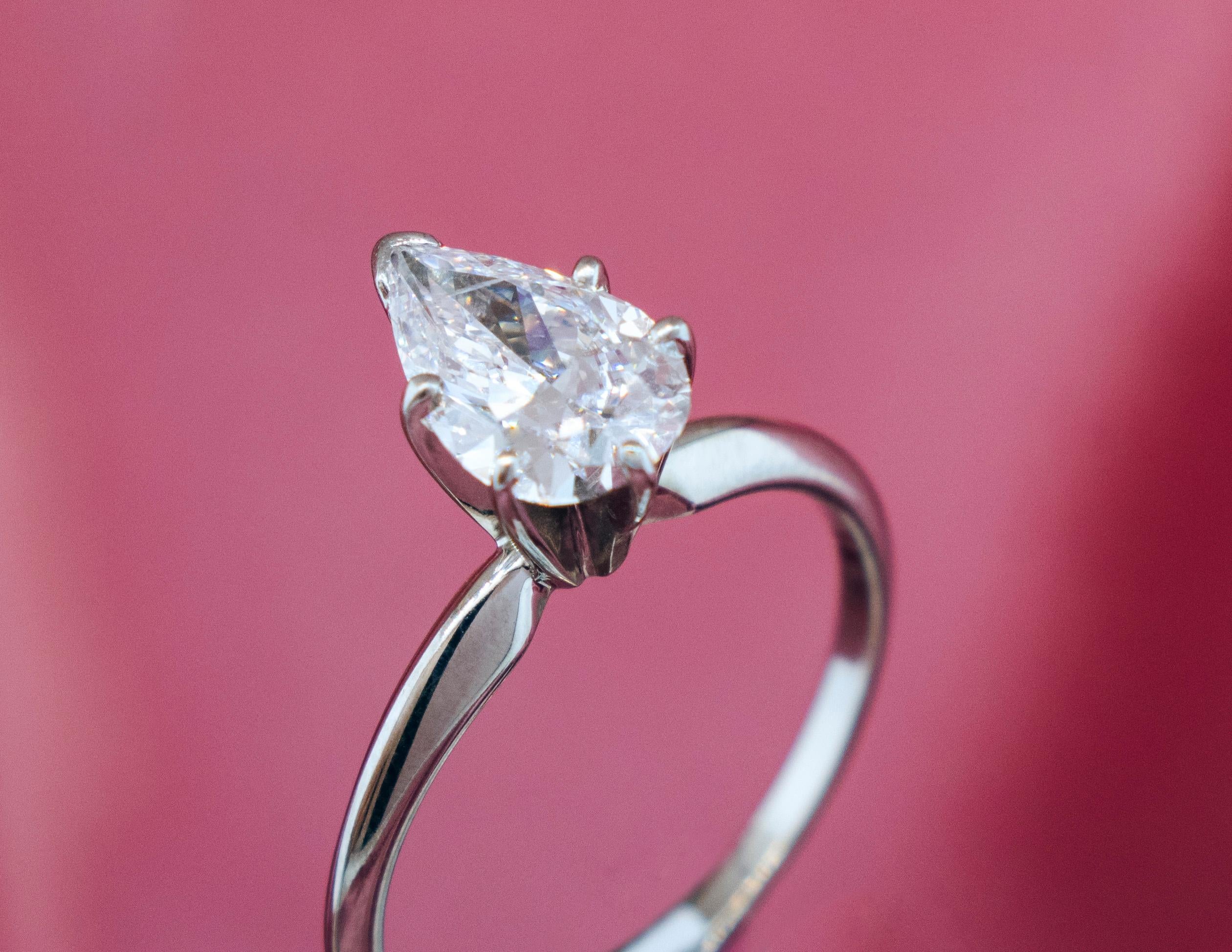 A Pear Brilliant Diamond mounted in a 14 Karat White Gold Solitaire Engagement Ring. The Diamond is GIA certified to be 1.03 carats, E Color, SI2 Clarity.

Metal: 14 Karat White Gold 

Stones: Pear Brilliant Diamond 1.03 carats. 

Color: E

Clarity:
