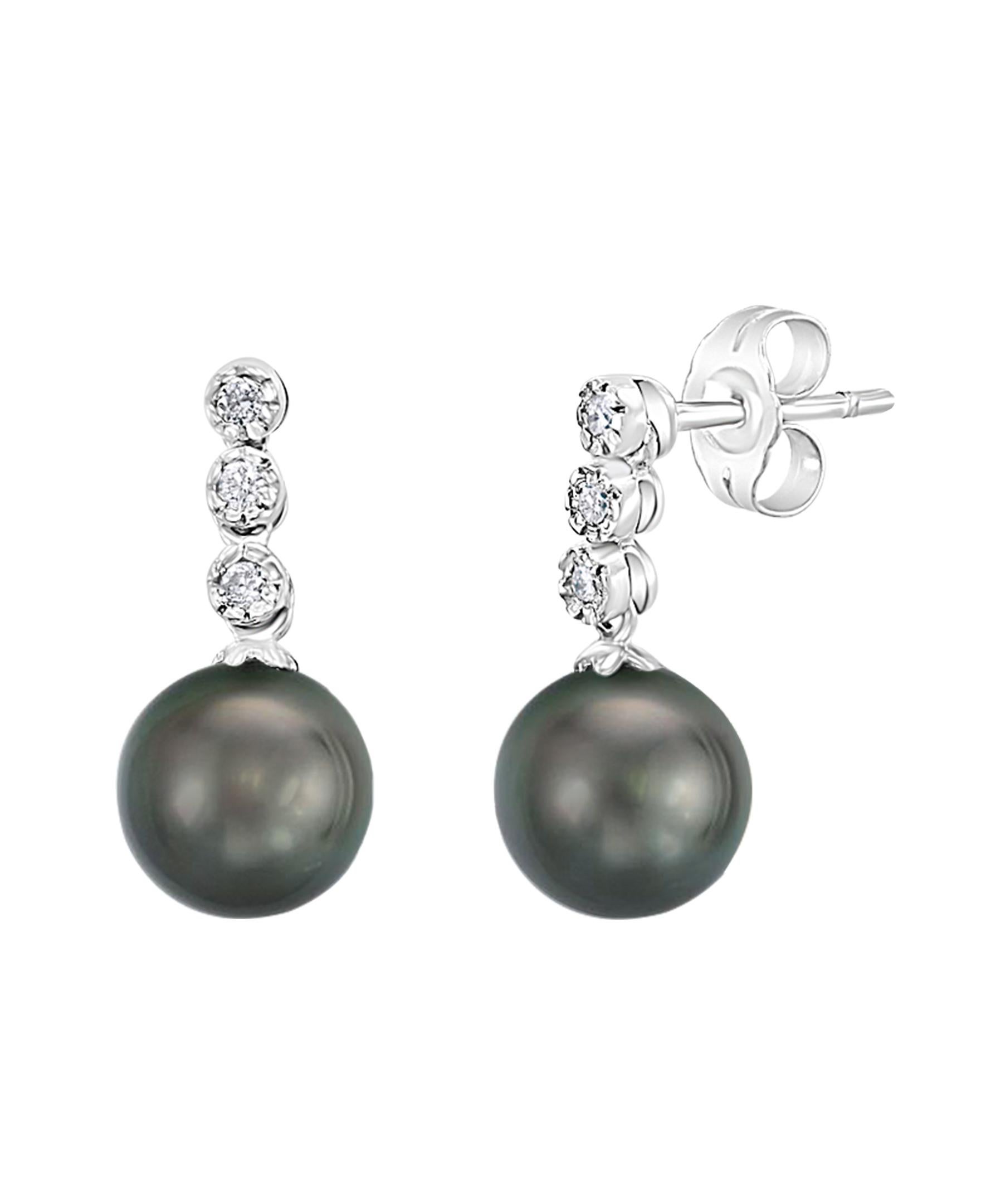 These elegant Diamond and Pearl earrings contain South Sea Tahitian dark green round cultured pearls measuring 7-8mm dangling from 0.09 carats of diamonds set in white gold. Simple, yet elegant, these earrings are a great addition to any