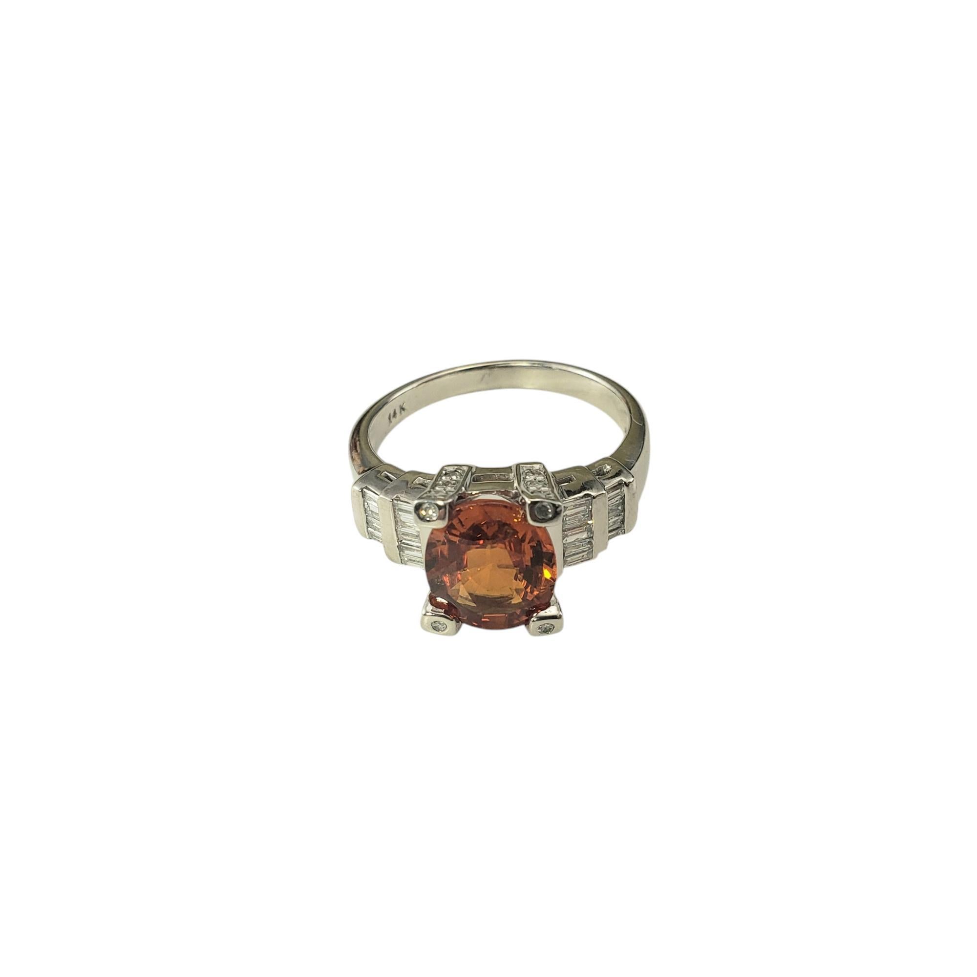 14K White Gold Spessartite Garnet and Diamond Ring Size 8 JAGi Certified-

This stunning ring features one oval cut spessartite garnet (10.2 mm x 8.2 mm), 18 baguette cut diamonds and 16 round single cut diamonds set in classic 14K white