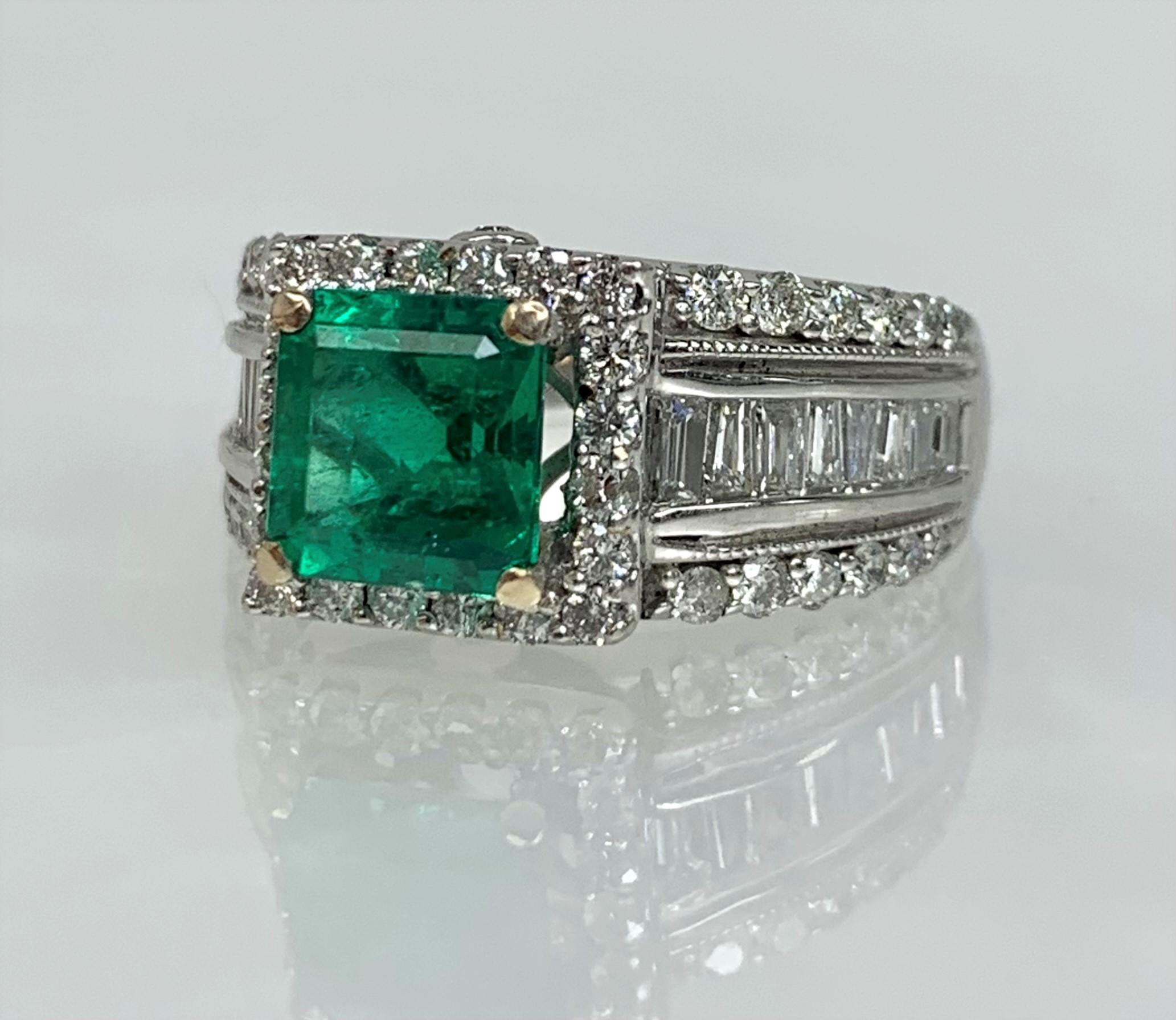A luxurious and vibrant Colombian emerald ring featuring a square/emerald cut center stone weighing 1.96 carats set amidst alternating rows of of baguette and round shaped diamonds weighing 2.53 carats of diamonds set in solid 14k white