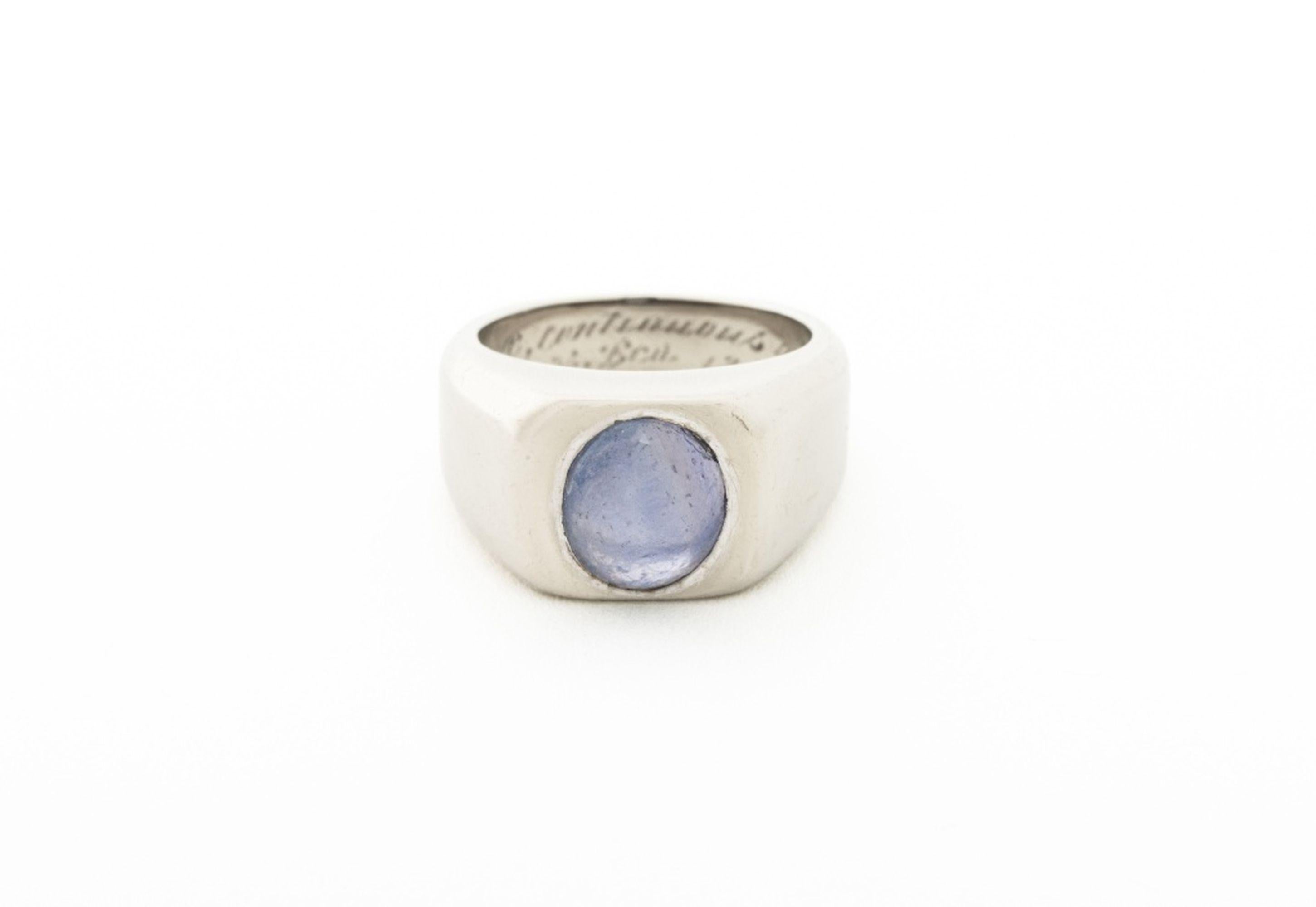 14K White Gold Star Sapphire Ring, featuring one flush set purple star sapphire cabochon weighing approx. 3.65 carats. Gold tested. Measuring approx. US size 5, 6.9 dwt. 

Provenance: From a 60 East End Avenue Estate. 
