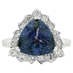 14k White Gold Tanzanite and 0.90ctw Round Brilliant Diamond Halo Ring