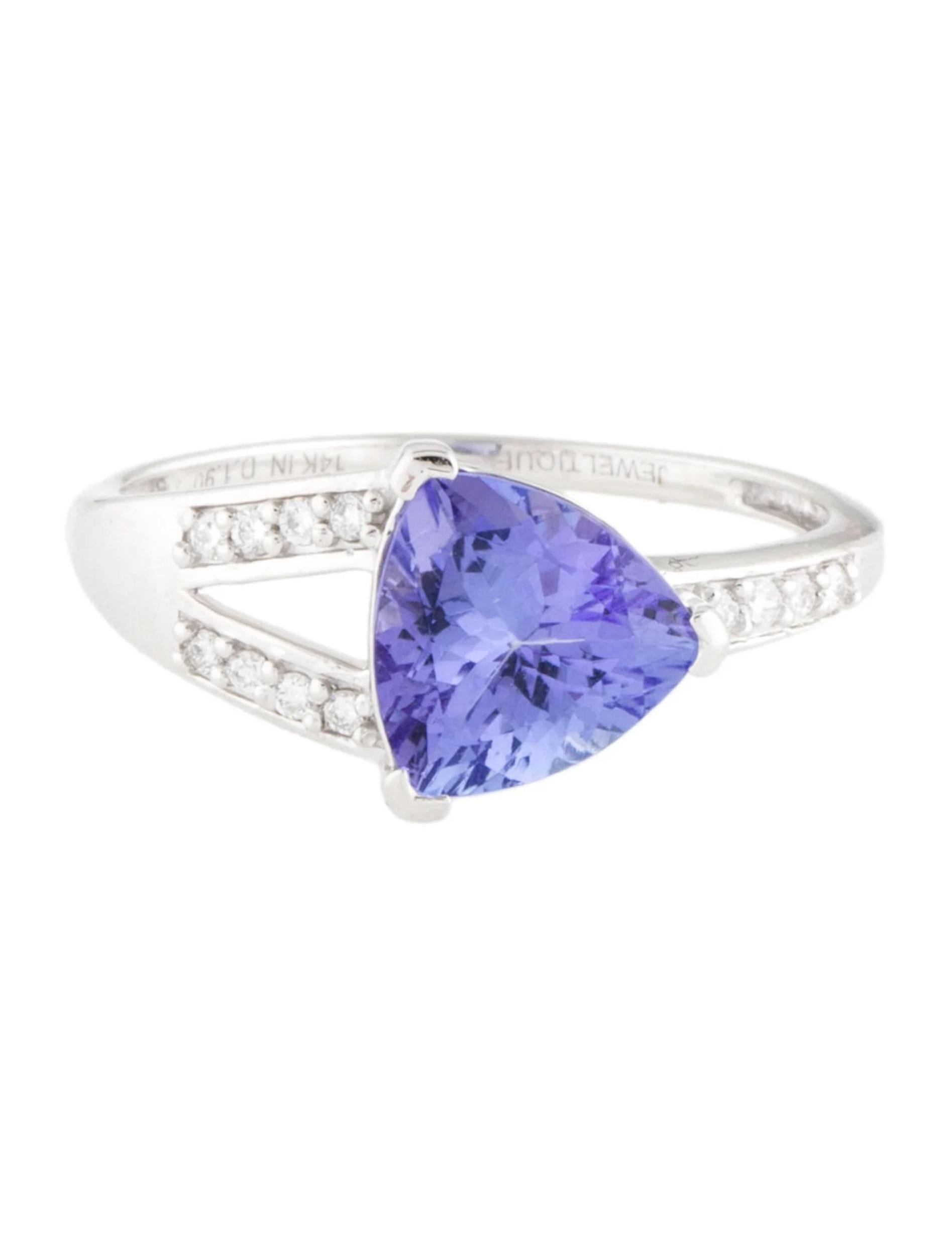 This exquisite 14K white gold cocktail ring is a true statement piece that will captivate any admirer. The centerpiece features a dazzling tanzanite gemstone, weighing 1.91 carats, in a unique modified triangular brilliant cut. Its mesmerizing