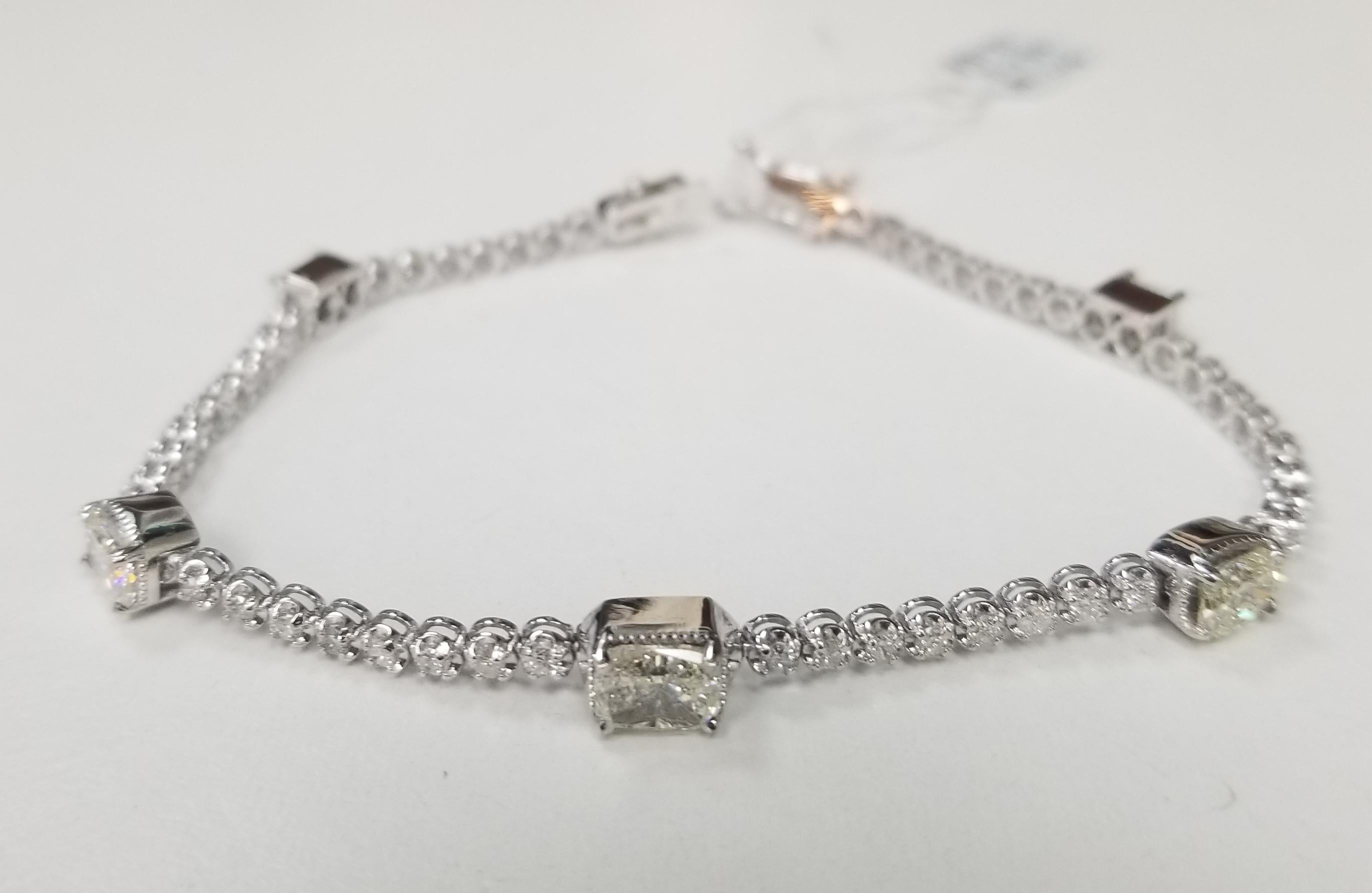 This is very beautiful 14k white gold custom made tennis bracelet with 5 fancy shape diamonds  and 51 round diamonds very fine quality diamonds, (Total weight 4.01cts.) bracelet measures 7 inches with clasp and double safety.
*Motivated to Sell –