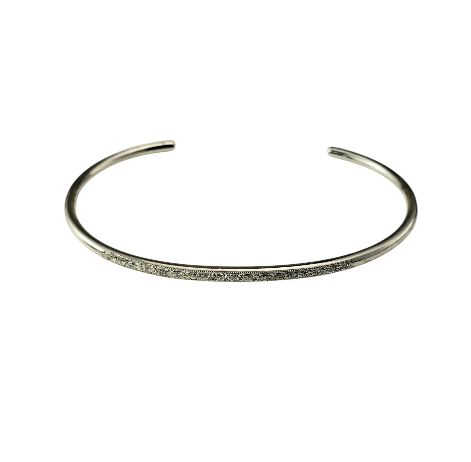 14K White Gold Thin Diamond Cuff Bracelet-

This elegant cuff bracelet features 18 round brilliant cut diamonds set in classic 14K white gold. This timeless accessory adds a touch of sophistication to any ensemble.

Approximate total diamond weight: