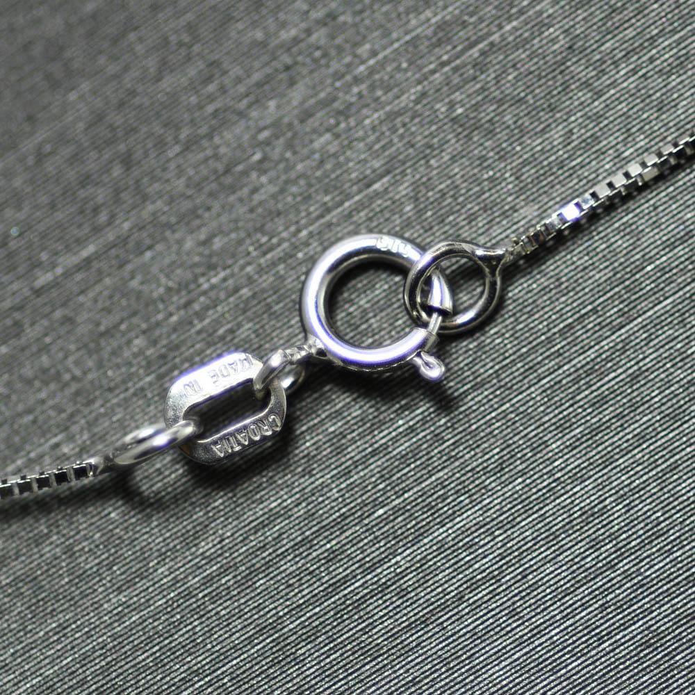 Three diamond pendant necklace in 14k white gold.
Stamped 14k and weighs 4 grams.
The diamonds are round brilliant cuts, .45 total carats, J color on average, Si clarity, and good cuts.
The pendant measures 1 inch long.
The chain measures 17 inches