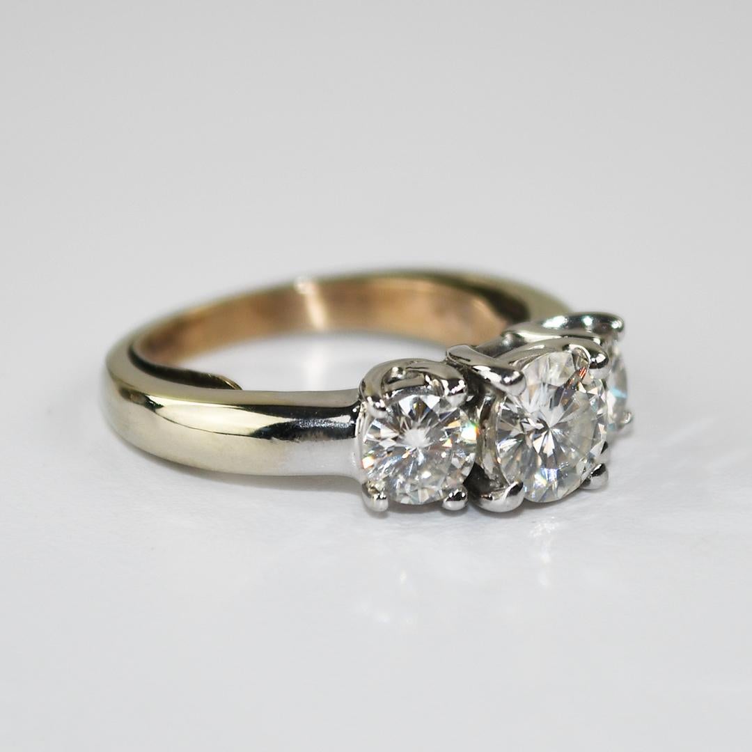Ladies' 14k white gold and moissanite ring.
Tests 58% gold using an XRF metals analyzer.
Moissanite is a diamond simulant that looks like a diamond and will test diamond on a traditional diamond tester, but it's lab grown.
There are 3 round