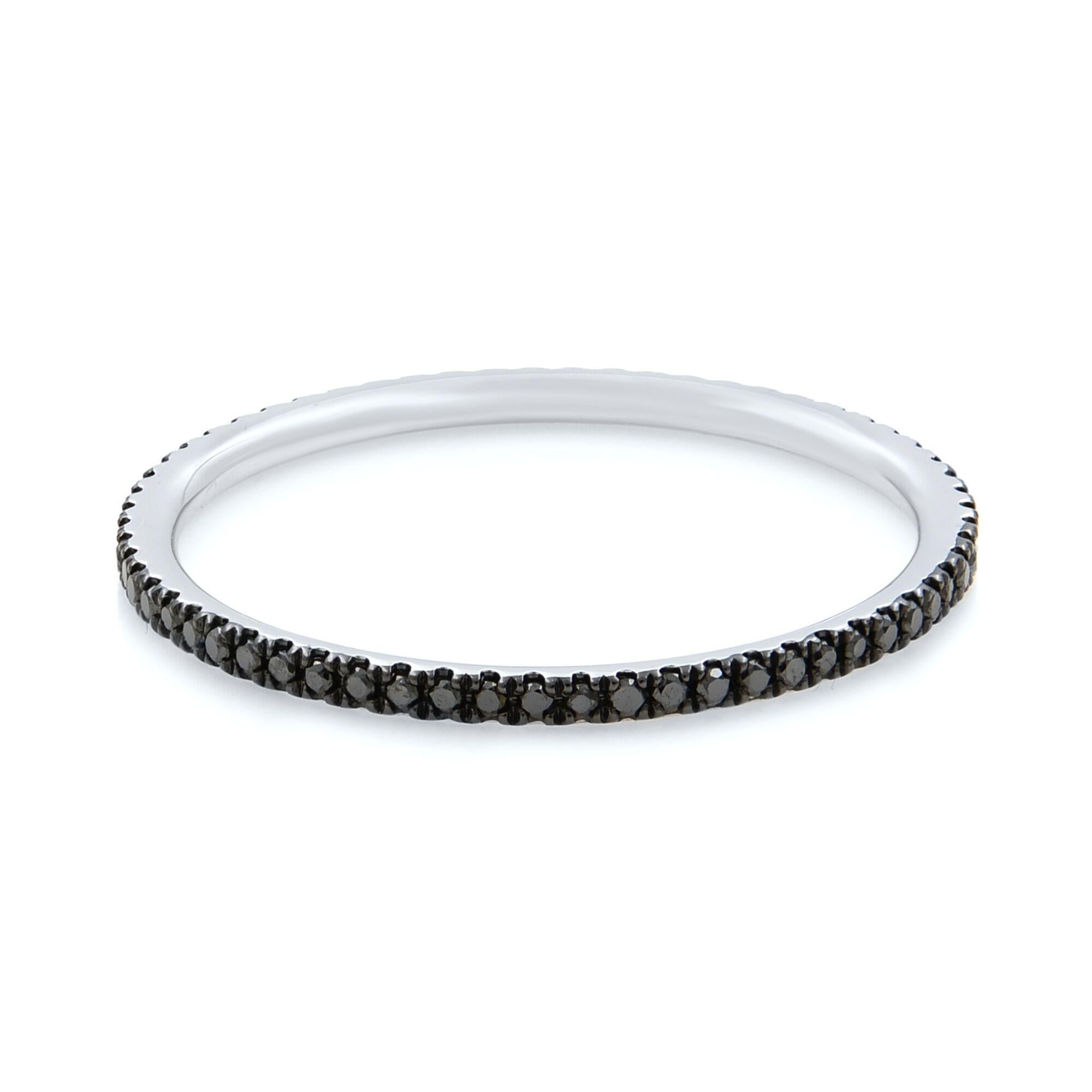 This beautiful black diamond eternity band is our original design ring. It is featuring a full circle of gleaming micro pave black diamonds set around the entire ring. This ultra-thin diamond band is the perfect complement to any collection or to