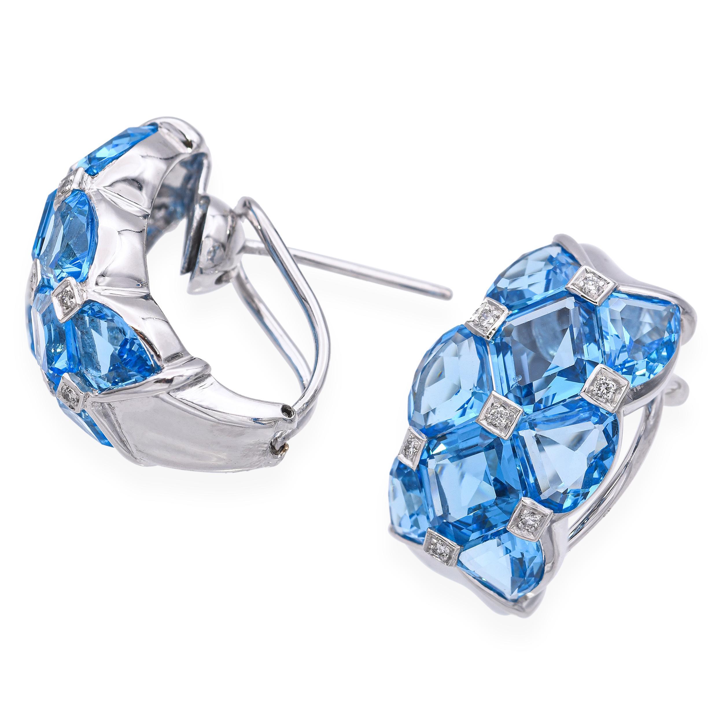 These elegant 14k white gold earrings feature brilliant blue topaz gemstones accented by sparkling diamonds for a refined and radiant look. The vibrant topaz stones are expertly faceted to catch the light, while the diamond accents add a touch of