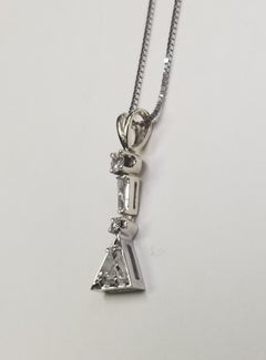 14k White Gold Triangle cut Diamond pendant weighing .51pts.