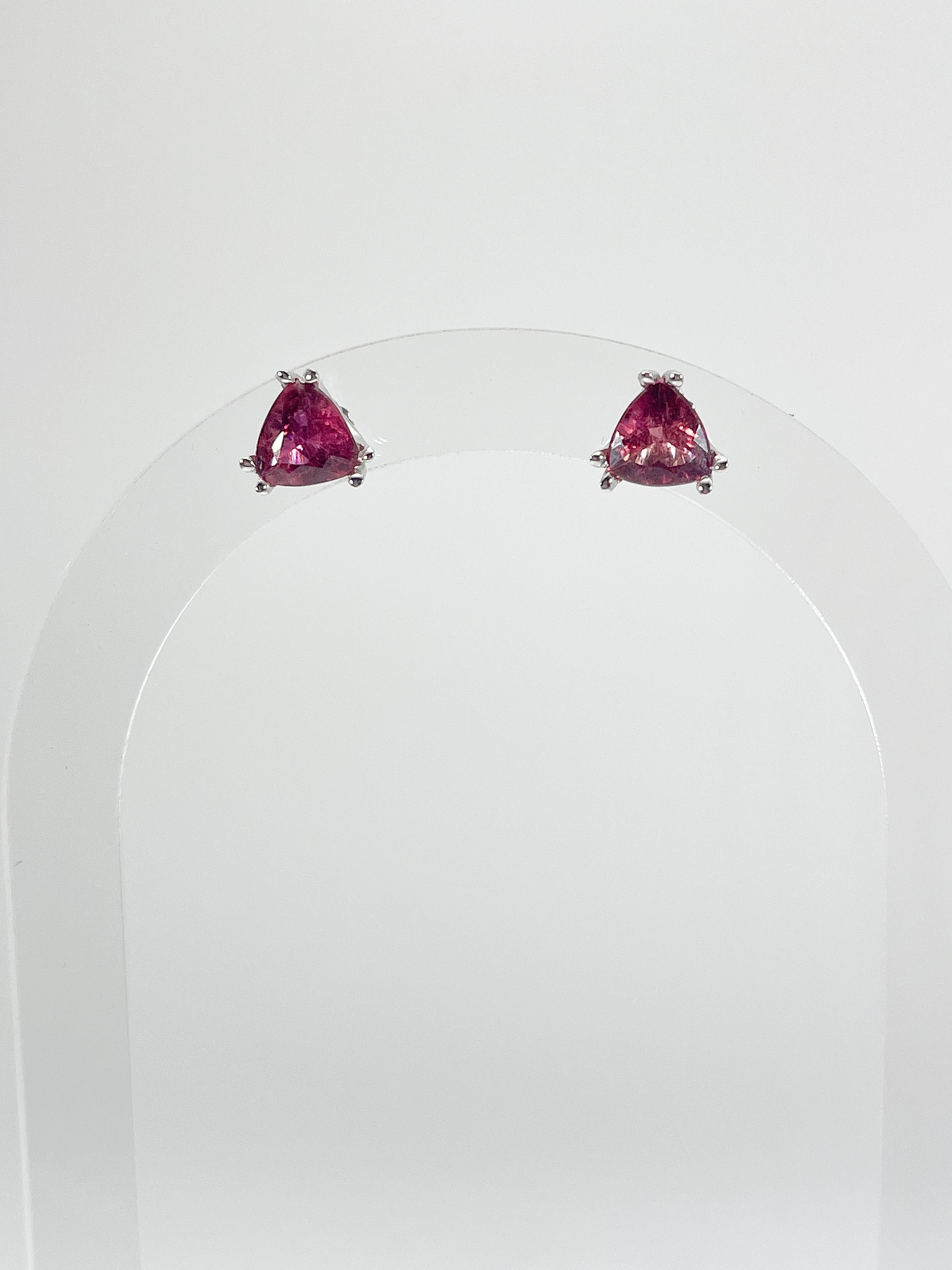 14k white gold trillion cut pink tourmaline double prong stud earrings. stone measures 8.2 x 8.2, the earrings have a total weight of 2.66 grams.