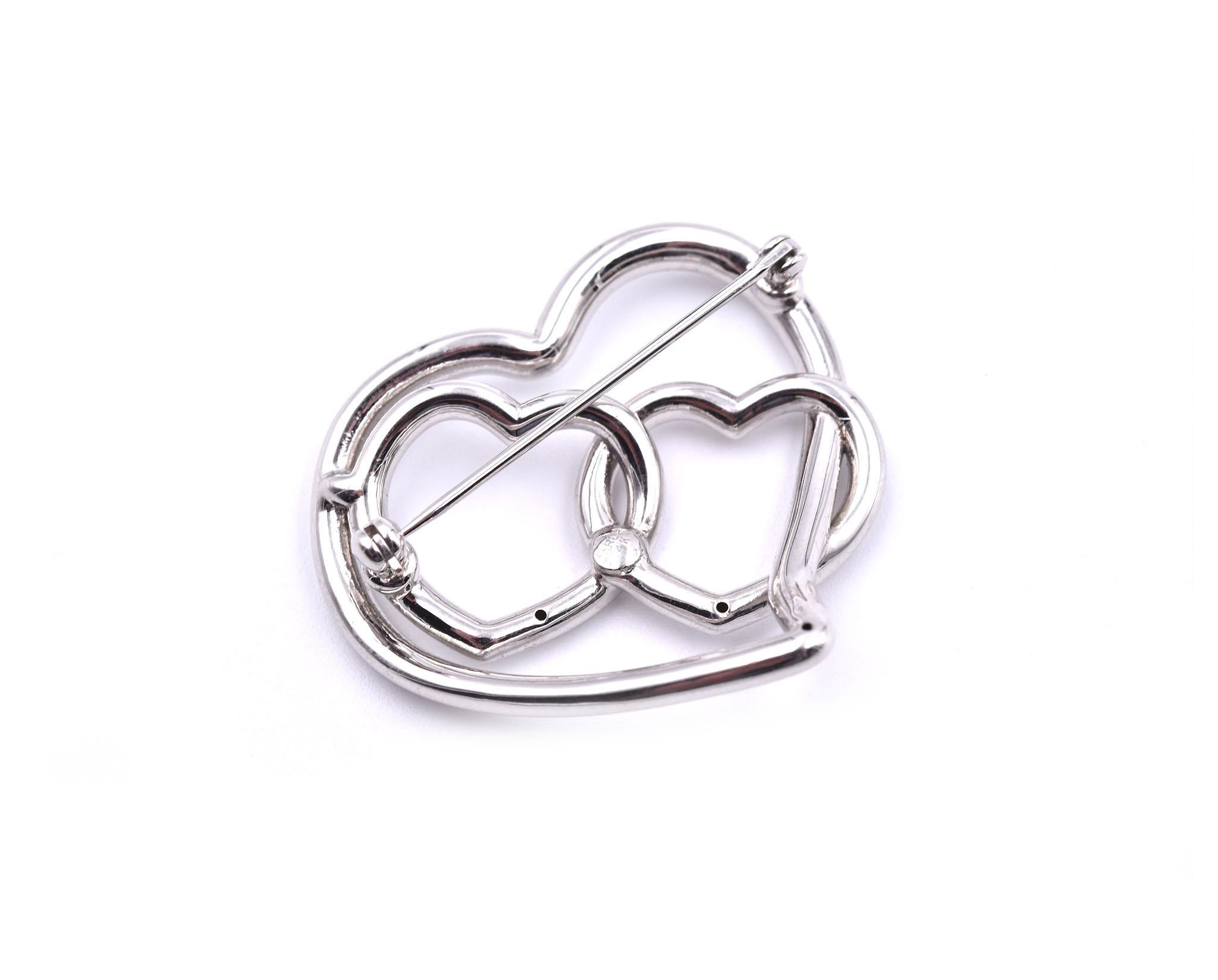 Designer: custom design
Material: 14k white gold
Dimensions: pin measures 32.81mm by 34.38mm
Weight: 3.77 grams
