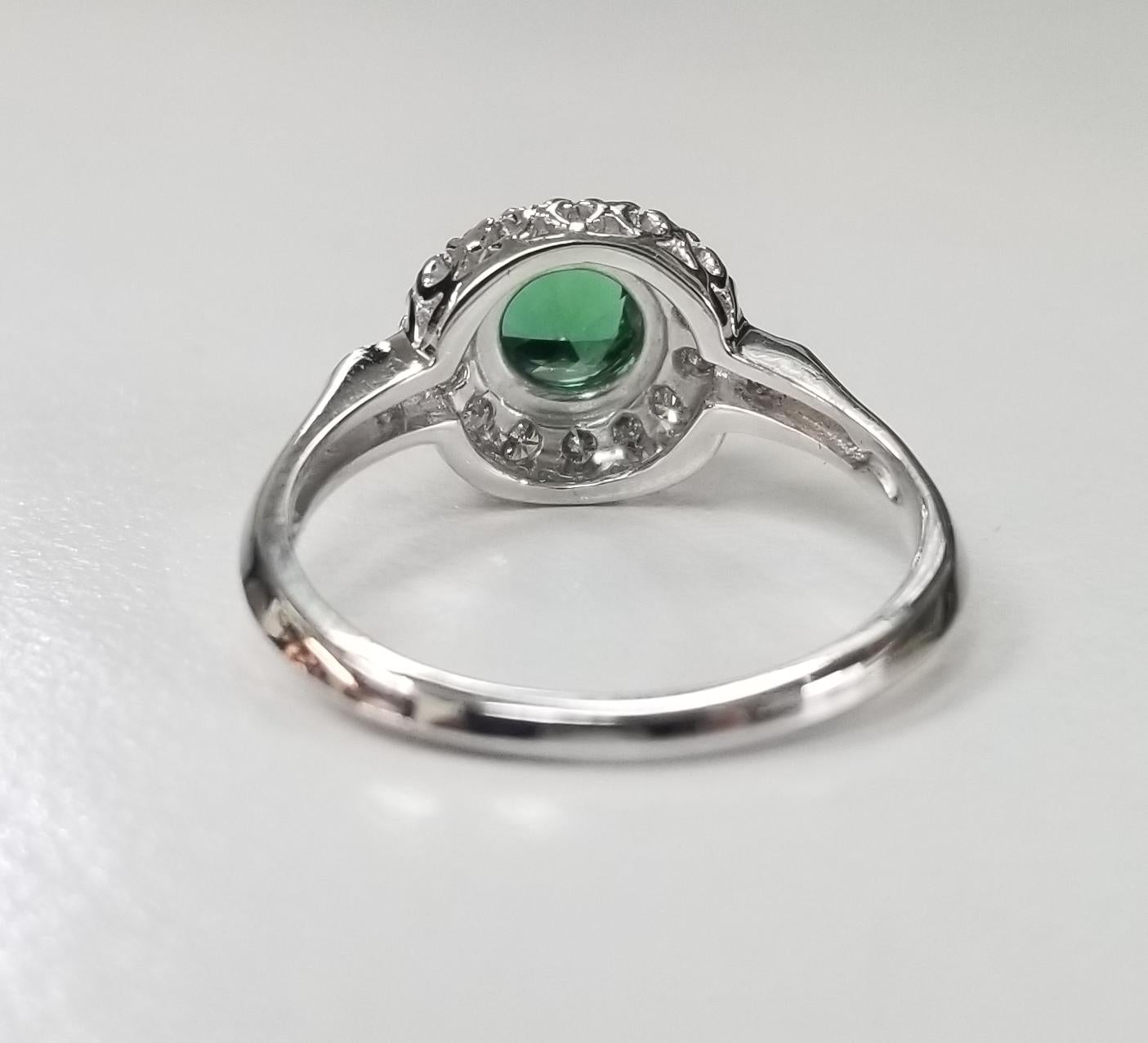 Round Cut 14 Karat White Gold Tsavorite and Diamond Halo Ring For Sale