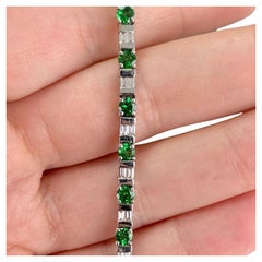 Bracciale tennis con tsavorite e diamanti in oro bianco 14k