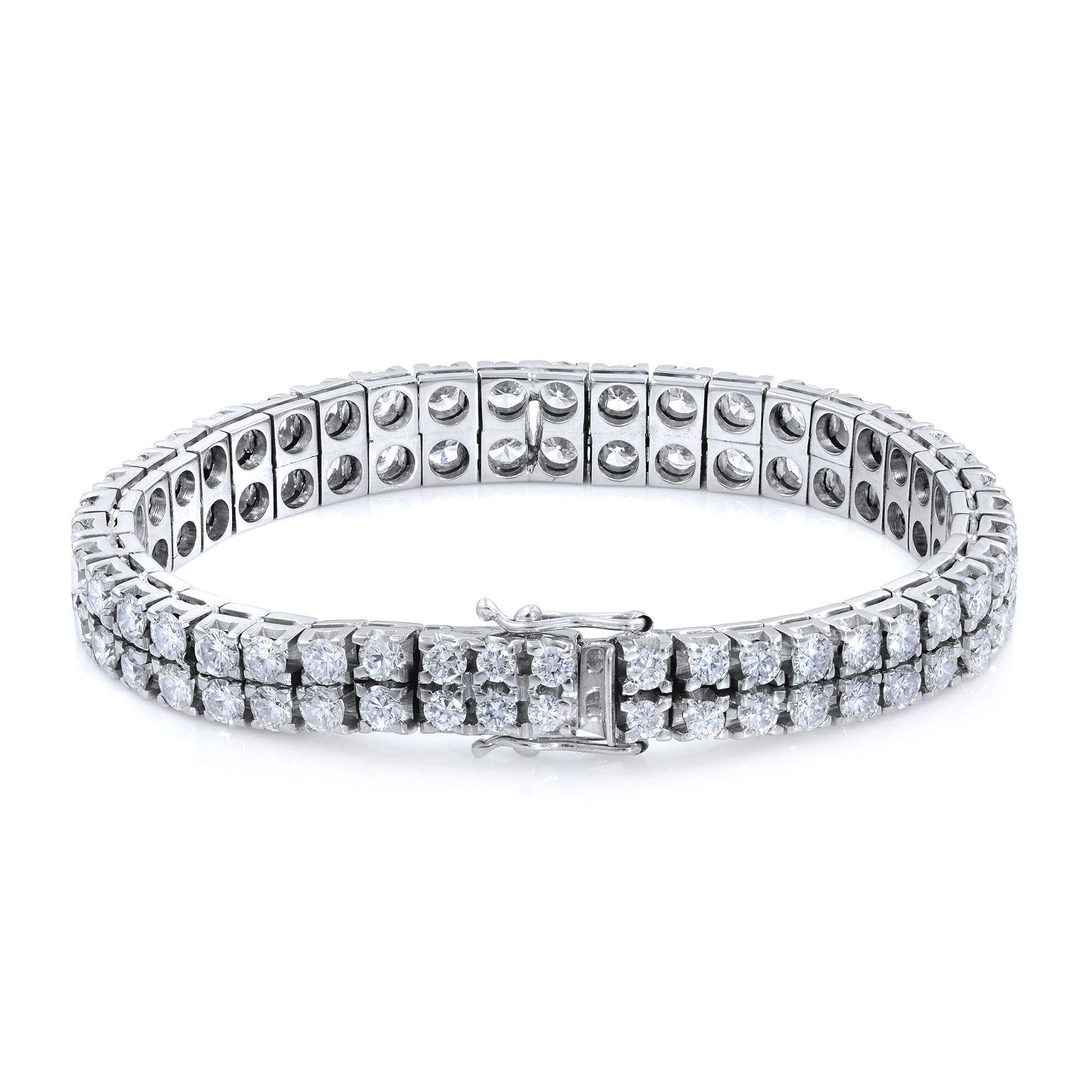 Our glamorous 14k white gold prong setting diamond tennis bracelet features two rows of round diamonds totaling 11 carats, 86 stones all together. The diamonds possesses the clarity and color of H and VS. If a line of sparkling round diamonds inst