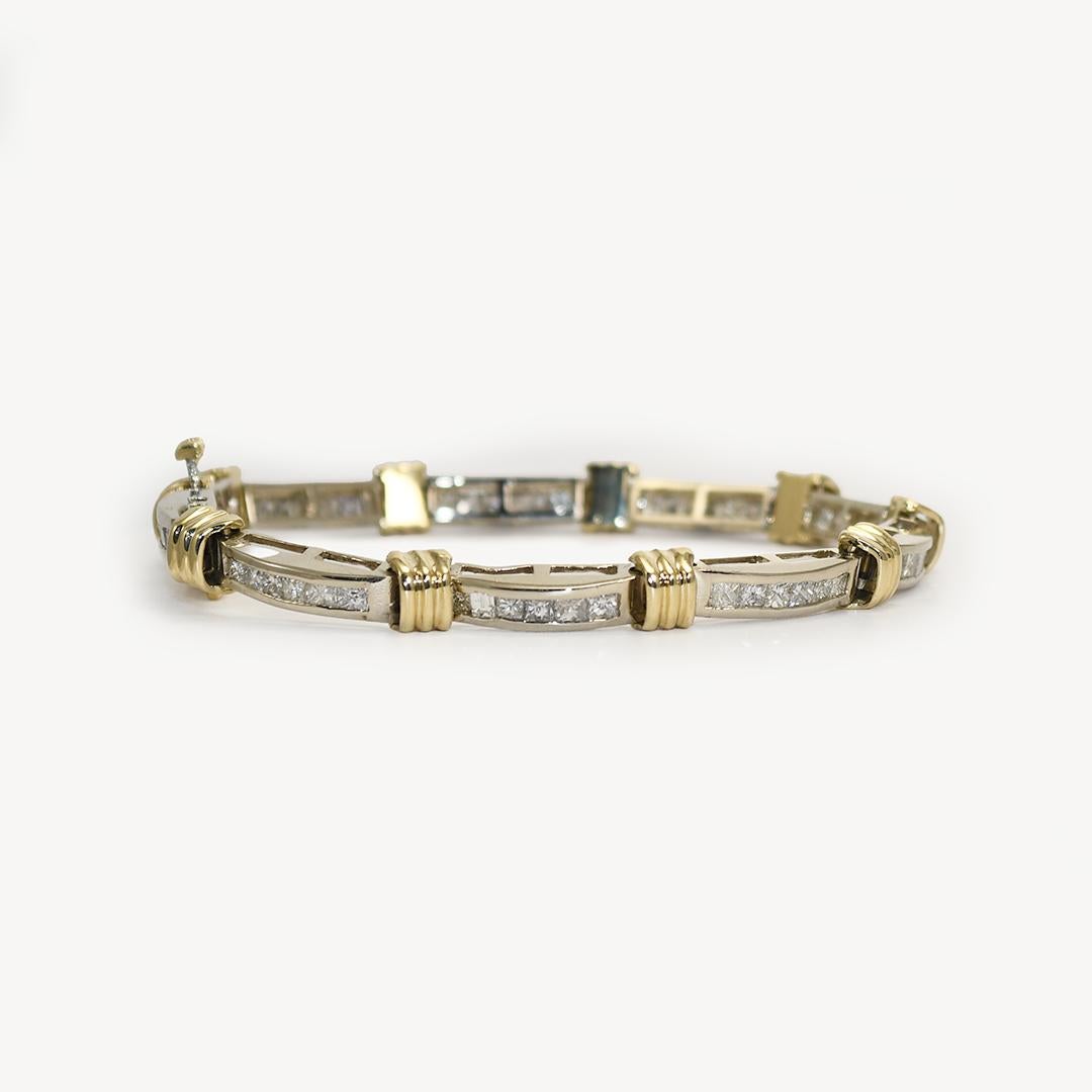 Ladies' diamond tennis bracelet with 14k white gold and yellow gold setting.
The safety hinge is stamped 14k.
The bracelet tests .564% gold with an XRF analyzer.
Plumb 14k should be .585%.
The diamonds are square and rectangle brilliant cuts,