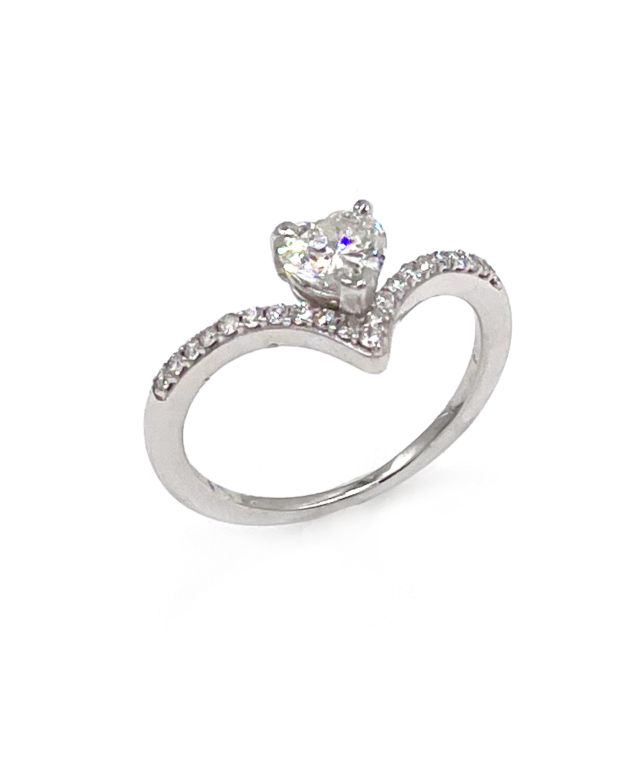 14K white gold v-shape ring with 0.15 carat round diamonds and 0.47 carat heart cut center diamond. H color, SI2 clarity.

* Finger size: 6