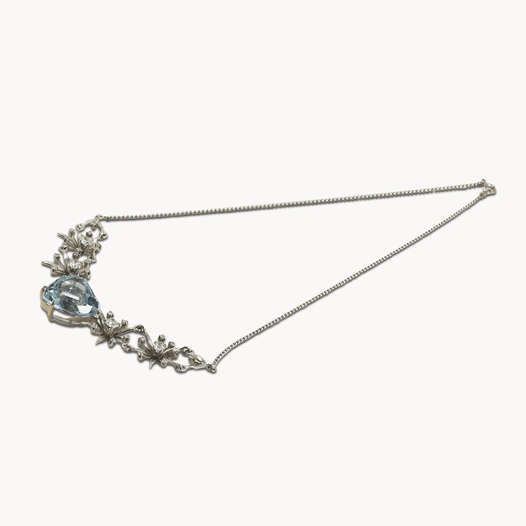 Ladies' vintage aquamarine and diamond necklace in white gold.
The gold is not stamped and tests  .52% gold with an XRF gun, slightly under 14k.
Necklace's gross weight is 20 grams.
The center stone is a heart-shaped aquamarine, 25.00 carats, a nice