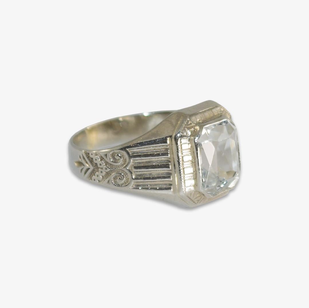 Ladies vintage 14k white gold and aquamarine ring.
Tests 57.8% with an XRF metals analyzer.
The ring weight is 2.8 grams.
The aquamarine is a pale blue, rectangular cushion cut, 1.50 carats.
Some abrasions on the top facet junctures can be seen with