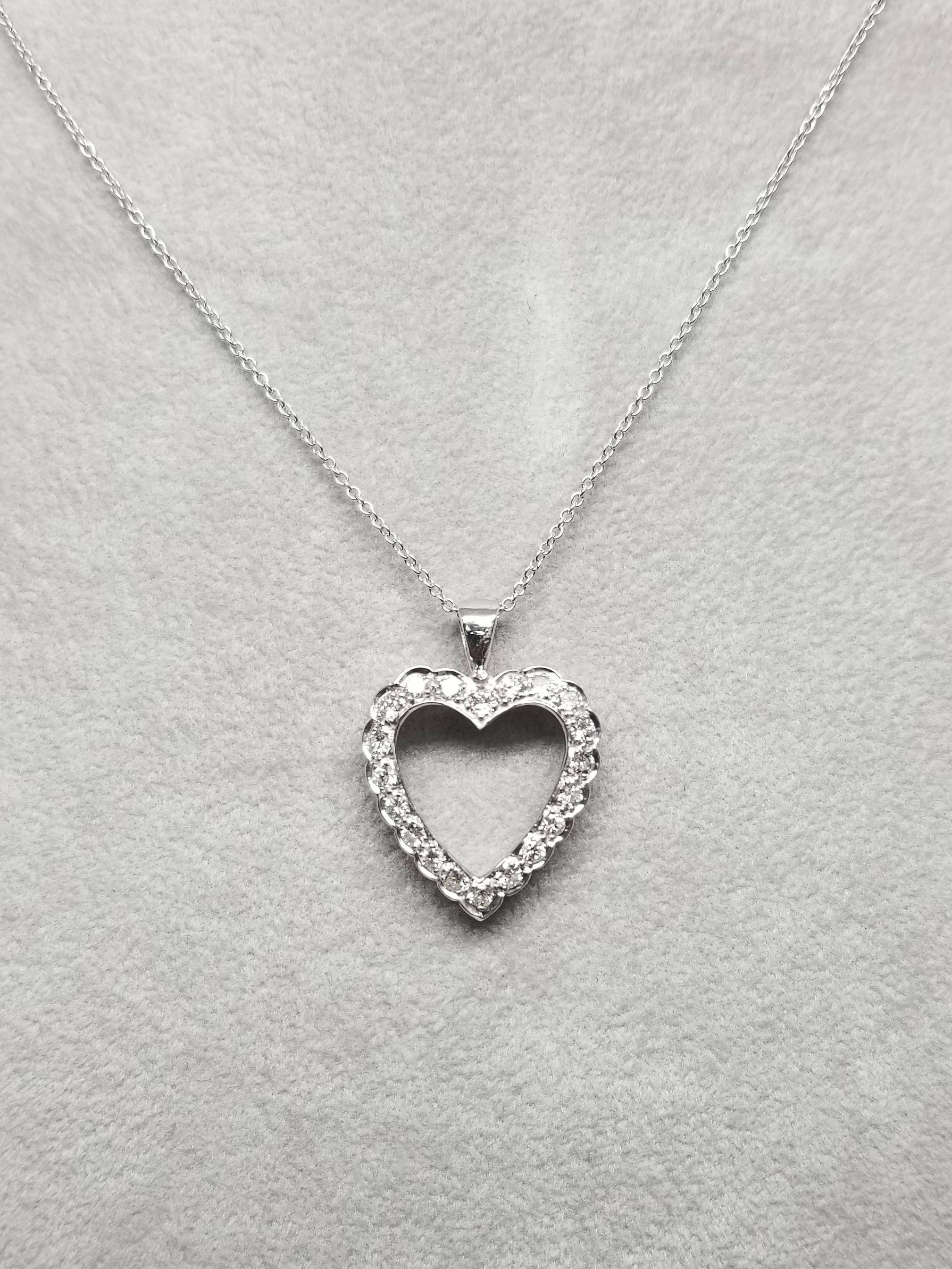 14k white gold vintage Art Deco Style diamond heart pendant, containing 20 round full cut diamonds of very fine quality weighing 1.00cts. on 16 inch chain.