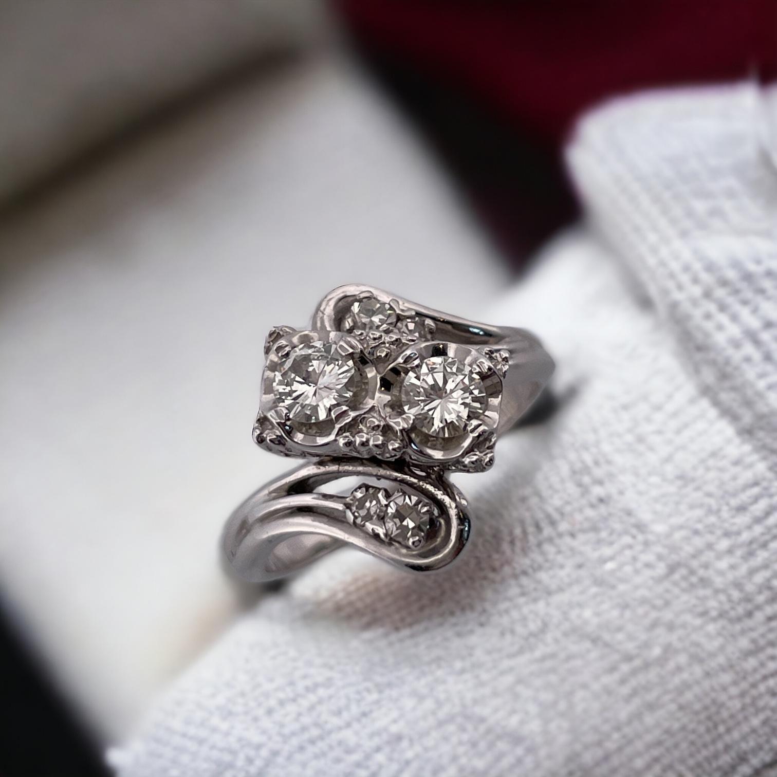 Embrace timeless elegance with this 14K White Gold Vintage Bypass Diamond Ring. Featuring a unique bypass design, this exquisite ring showcases sparkling diamonds set in solid white gold. A sophisticated piece that adds a touch of vintage charm to