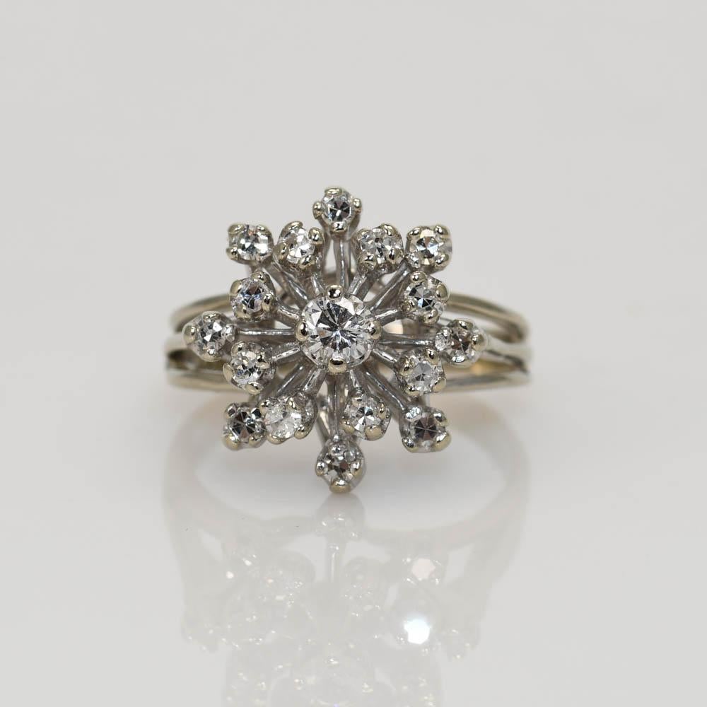 14K Vinatge starburst cluster ring.
The ring has one .15ct Round Brilliant SI2-G, with 16 single cut Diamonds surrounding. .30tdw
SI1-SI2 clarity, G-H Color.
Tests 14k
Weighs 4.9gr, size 6
Can be sized up or down one size for additional fee