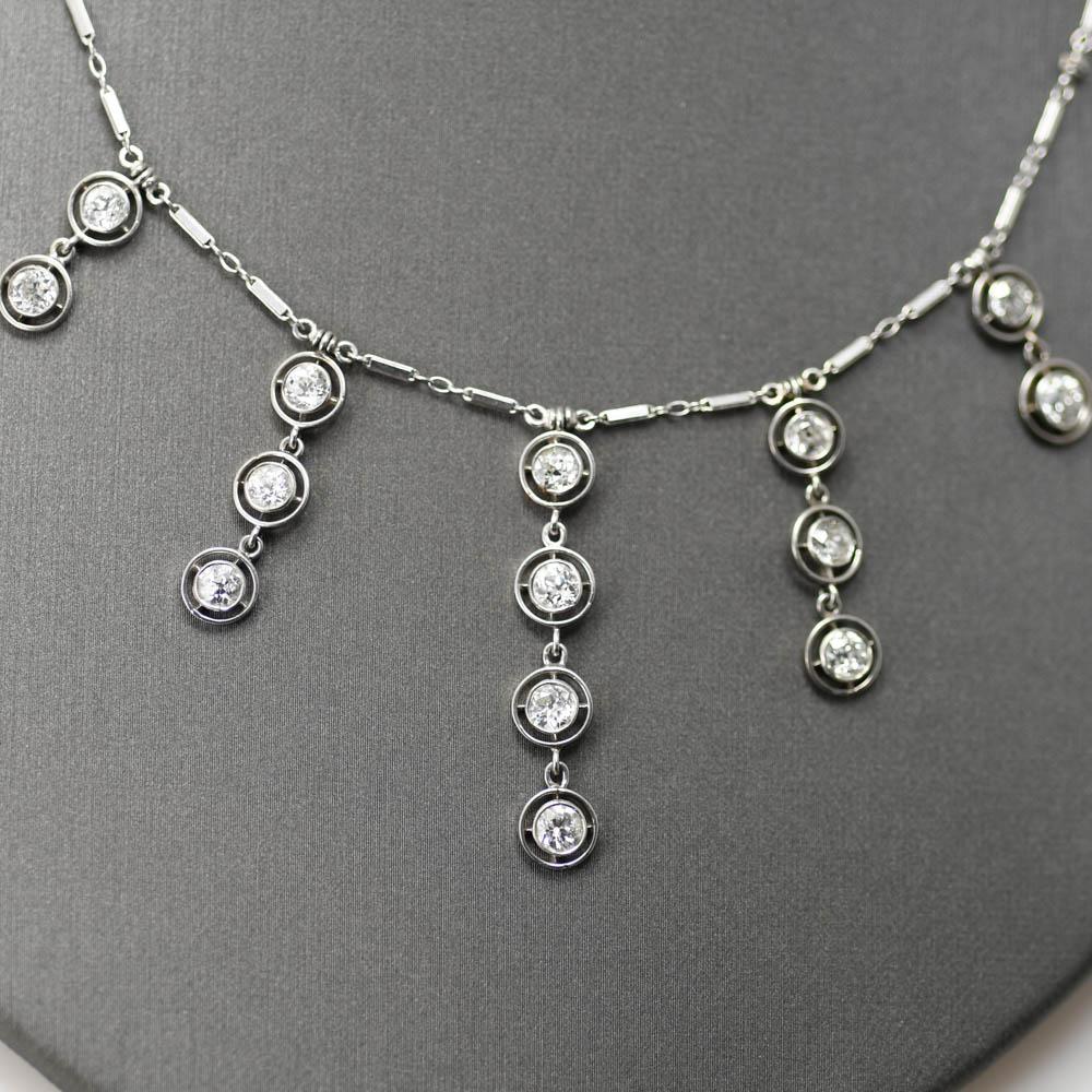  14K white gold Diamond Necklace. There are 14 Old euro cut Diamonds ranging from .15ct- .25ct with  2.80tdw.
Clarity and Color ranges from H-I, VS2-SI1
The necklace weighs 9.6g and Measures 17in long


