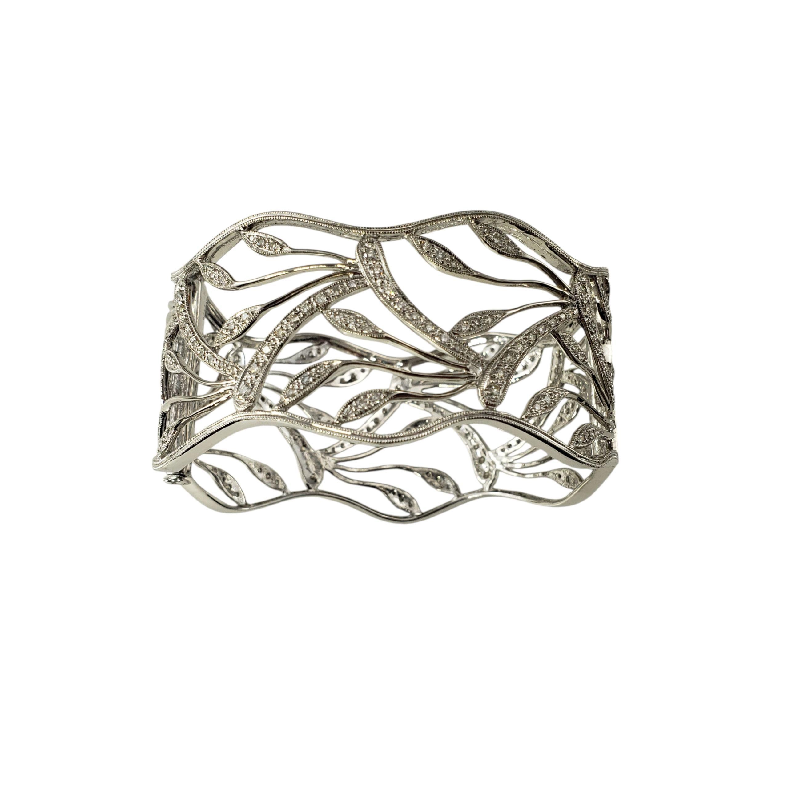14K White Gold Bangle Cuff Bracelet JAGi Certified-

This striking cuff bracelet features and openwork leaf design adorned with 211 round brilliant cut diamonds. Balancing bold presence with delicate details, this piece is perfect for both everyday