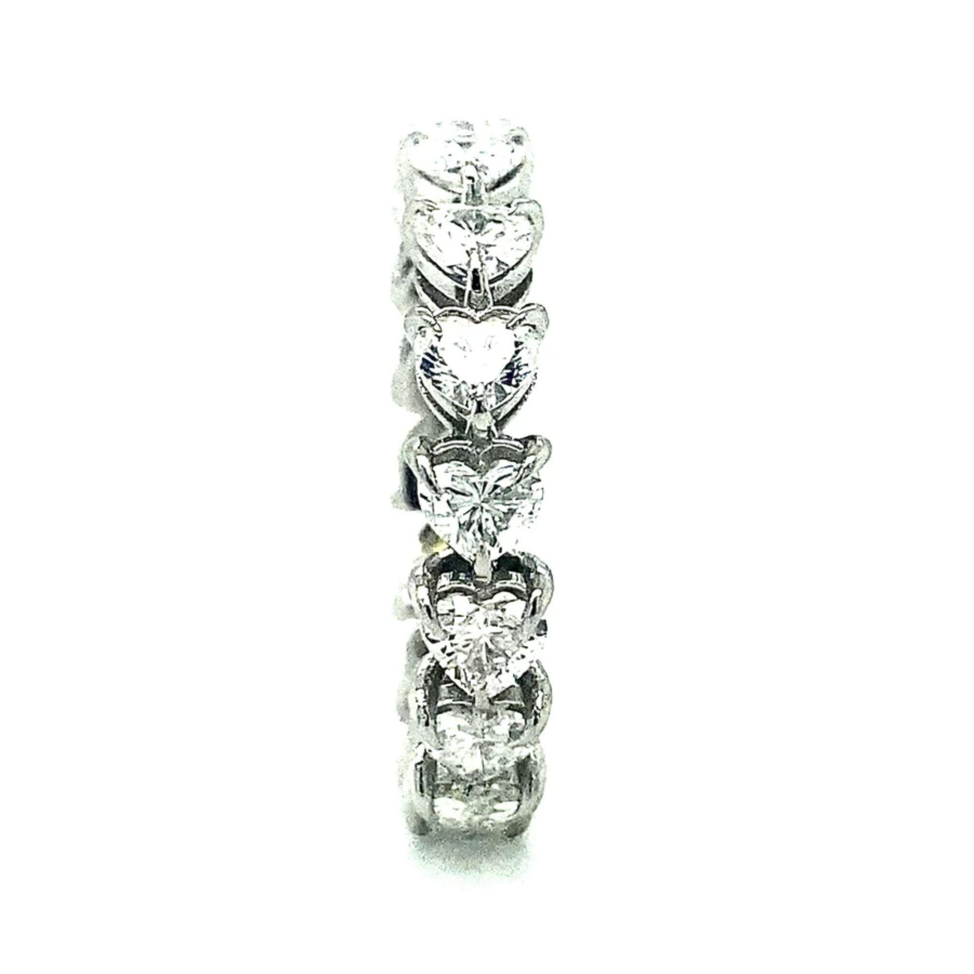 This ring is all heart. This eternity ring is composed of sixteen .25 carat diamonds set in our iconic heart shank. It will be the ultimate symbol of your love and devotion. The diamond is LIGHT, life, the SUN; it is an emblem of purity and