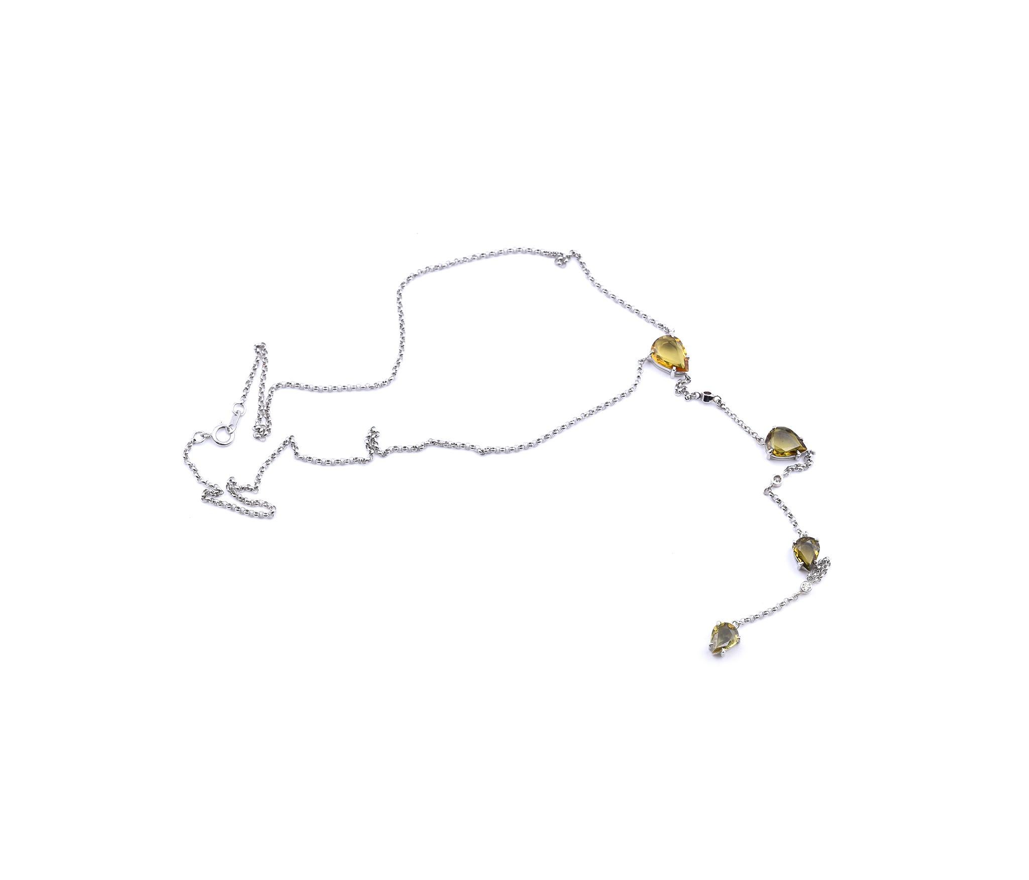 Designer: custom design
Material: 14k white gold
Yellow Thai Sapphire: 4 pear cut= 2.85cttw
Diamonds:  3 round brilliant cut= .05cttw
Color: G
Clarity: VS
Dimensions: necklace is 16-inches long with a 5 ½-inch drop. 
Weight: 5.62 grams