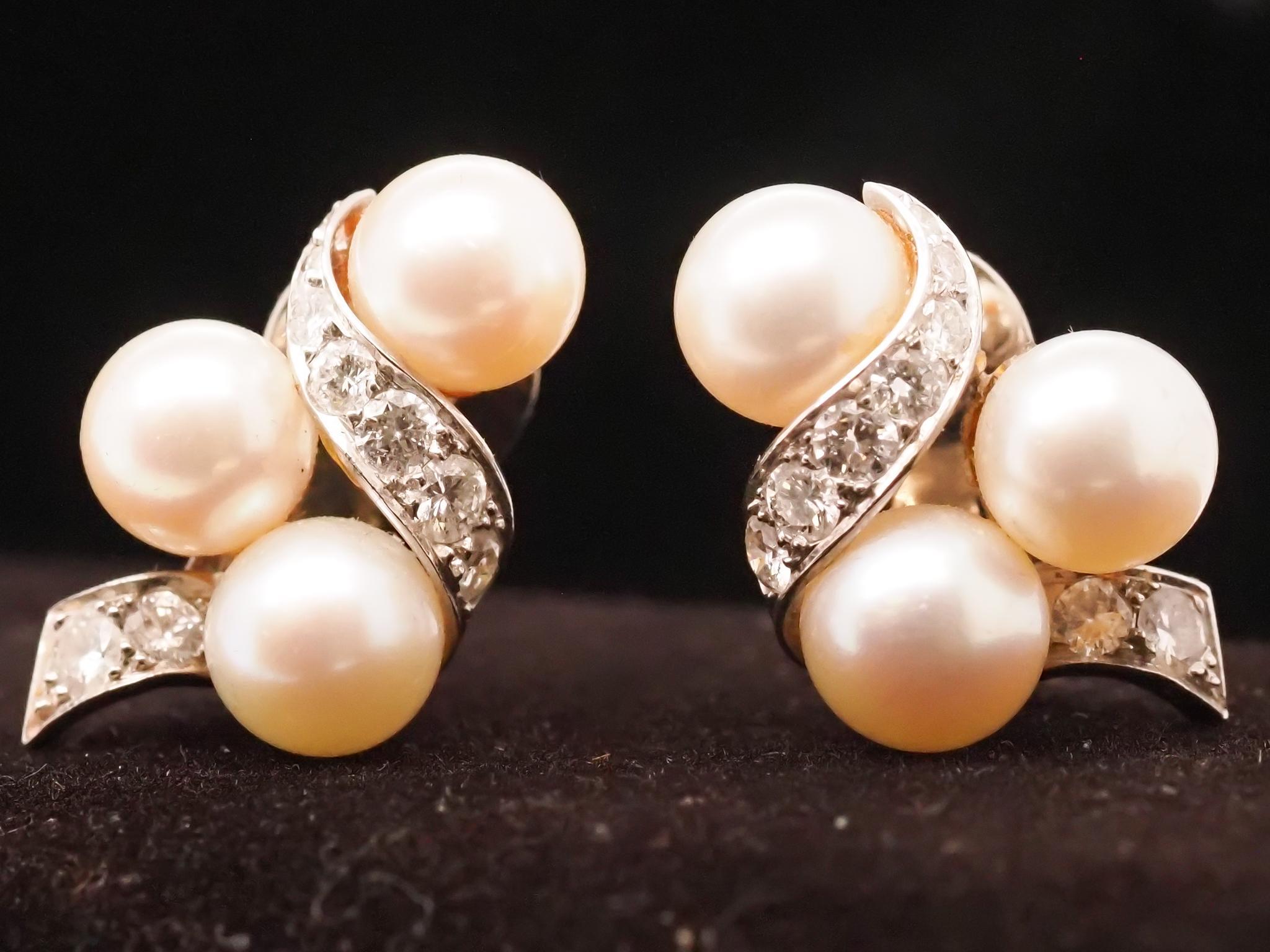Year: 1980s
Item Details:
Metal Type: 14K White Gold [Hallmarked, and Tested]
Weight: 5.5 grams
Diamond Details:
Weight: .40ct total weight
Cut: Round brilliant
Color: G
Clarity: VS
Pearl Details:
Size: 7mm each
Cut: Round Pearl
Color: