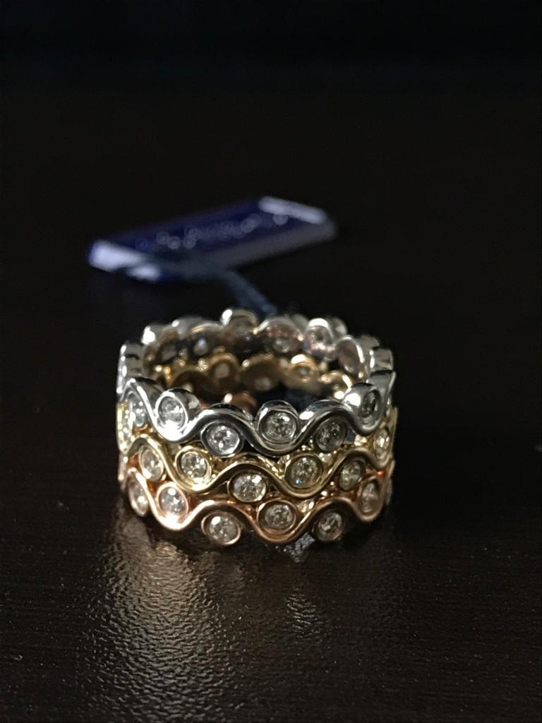 Modern 14 Karat White, Yellow, and Rose Gold Diamond Bezel Stacking Rings For Sale