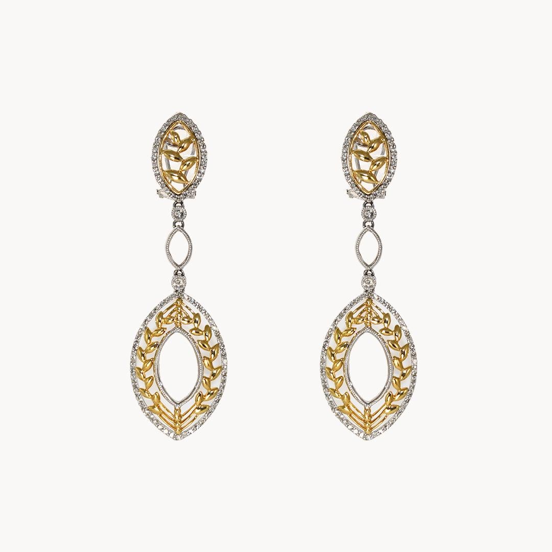 14k dangle earrings and matching pendant with diamonds.
The set is white and yellow gold, stamped 14k, and weighs 15.3 grams in total.
There are round single-cut diamonds around the edges, 1.25 total carats, i color, si clarity.
The earrings are 2