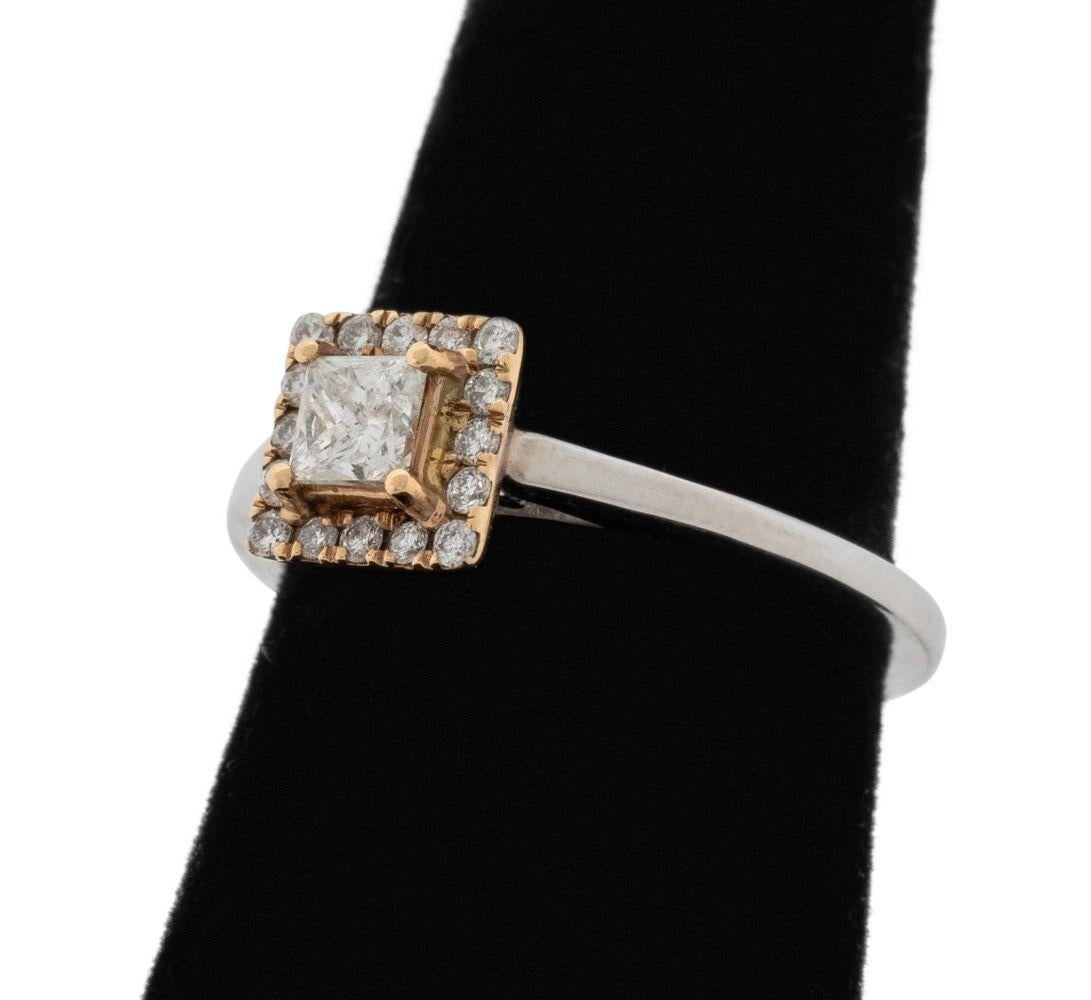 14K White Gold and Yellow Gold Diamond Ring, featuring one centered yellow gold prong set princess cut diamond weighing approx. 0.25 carat, I-J color / SI2 clarity, further adorned with 16 yellow gold prong set diamonds weighing approx. 0.08 carat,