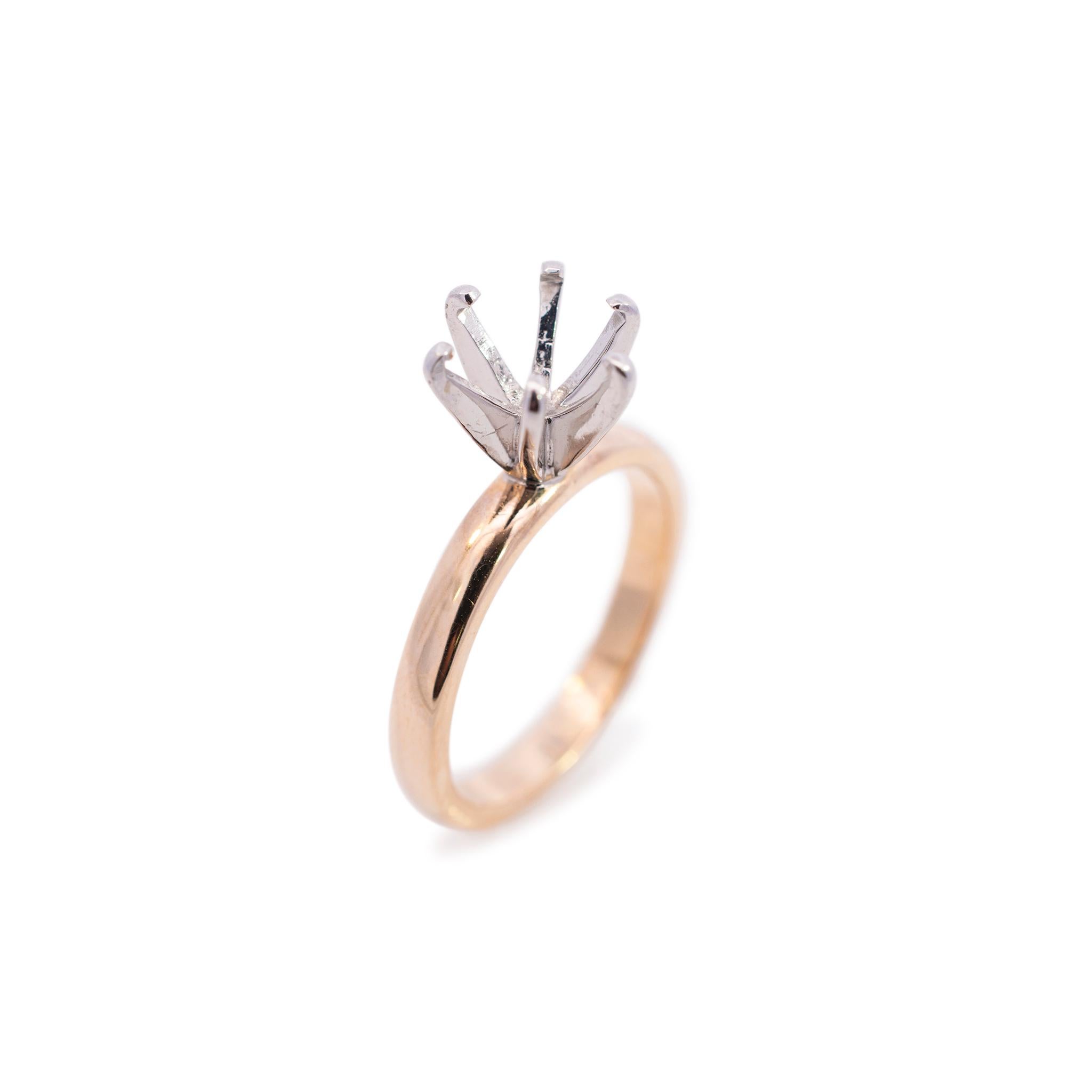 One ladies custom made polished 14K white & yellow gold, solitaire engagement, semi-mount ring with a soft-square shank. The ring is a size 5.25 and is 1.46mm thick tapering to 2.93mm in width. The ring weighs a total of 4.20 grams. Engraved with